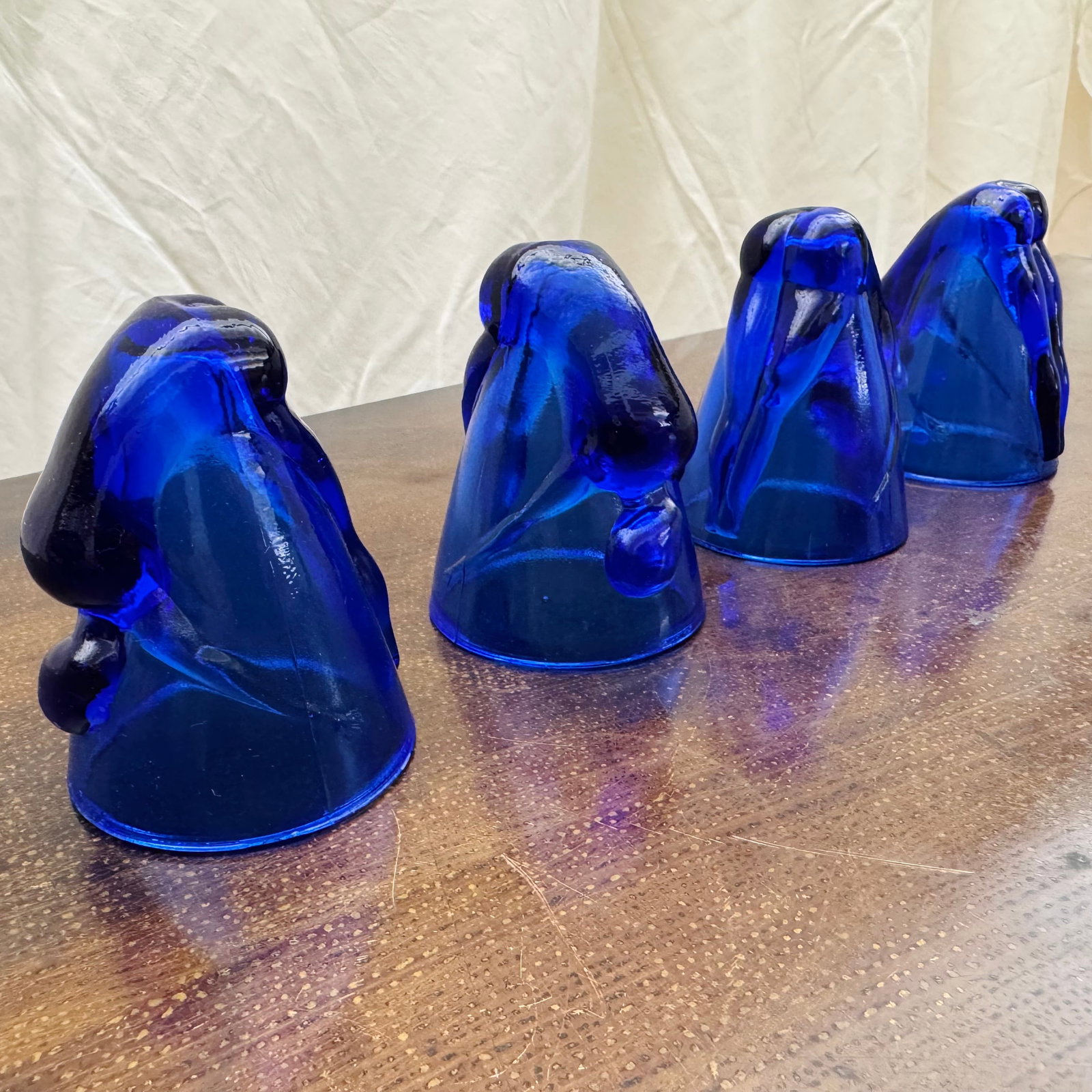 (Lot of) 4 Bottoms Up Shot Glasses: (Lot of) 4 vintage cobalt blue "bottoms up" shot glasses.