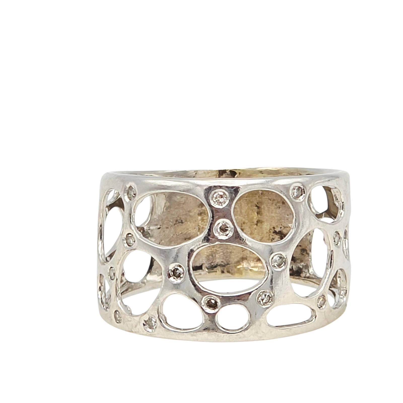 Diamond, 14k White Gold Ring: Featuring fourteen single-cut diamonds weighing a total of approximately 0.14 ctw., set in an openwork, 14k white gold ring mounting, size 9 3/4. Gross weight: 4.7 grams.