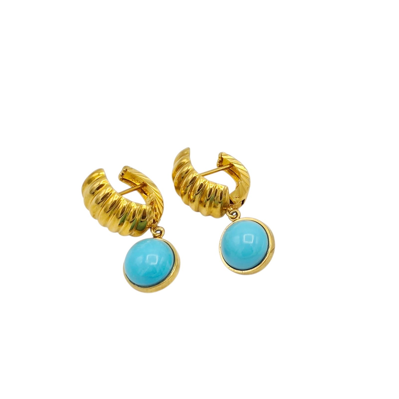Pair of Turquoise, 18k Yellow Gold Earrings: Featuring a round turquoise cabochon measuring approximately 8.7 mm, suspended by a textured, 18k yellow gold earring mounting. Gross weight: 6.0 grams.