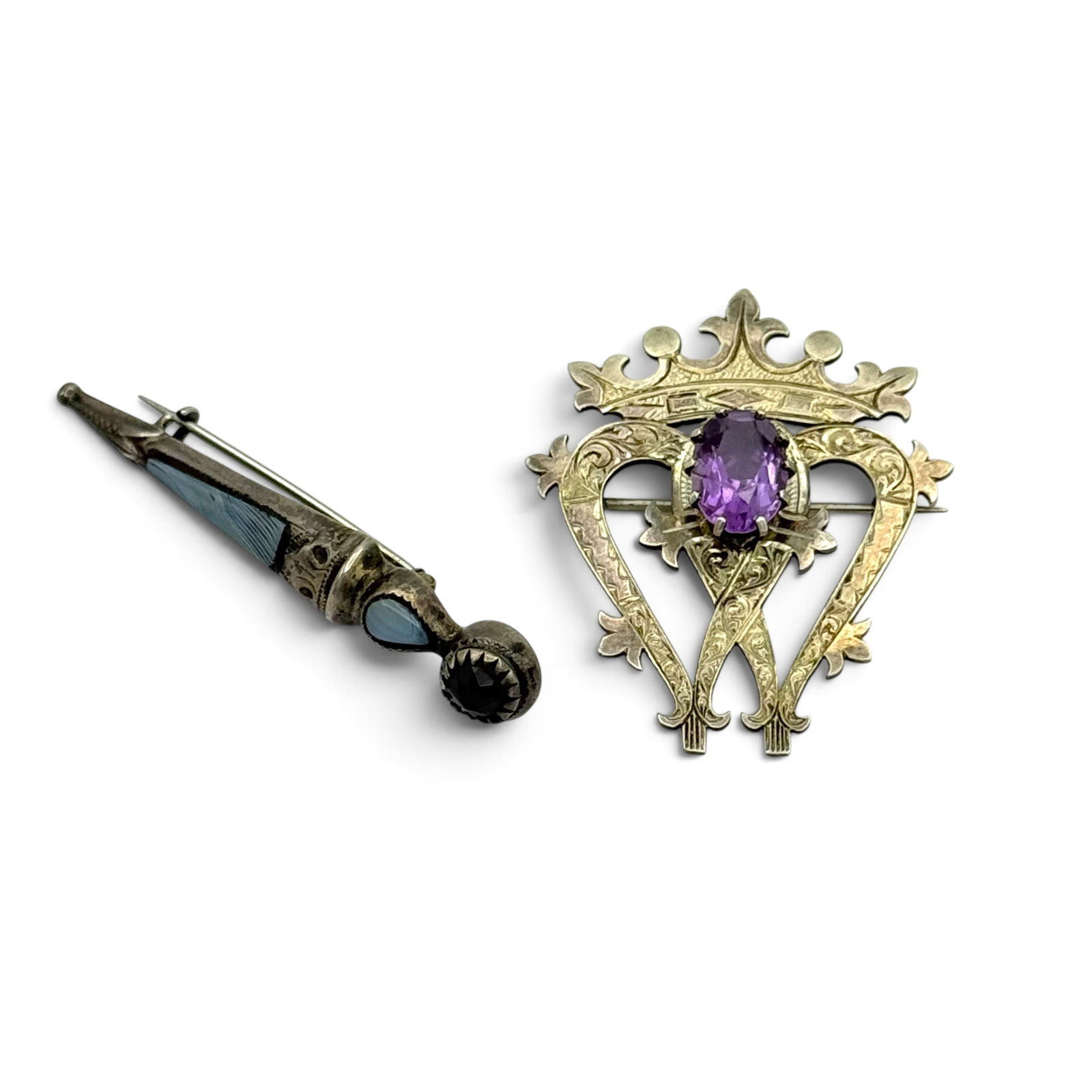 Collection of Two Amethyst, Agate, Sterling Silver PIns: Including one amethyst, sterling silver 'Luckenbooth' pin measuring approximately 1.80 x 1.45 inches, marks for Edinburgh, 1965; together with one Montrose agate, glass, sterling silver d