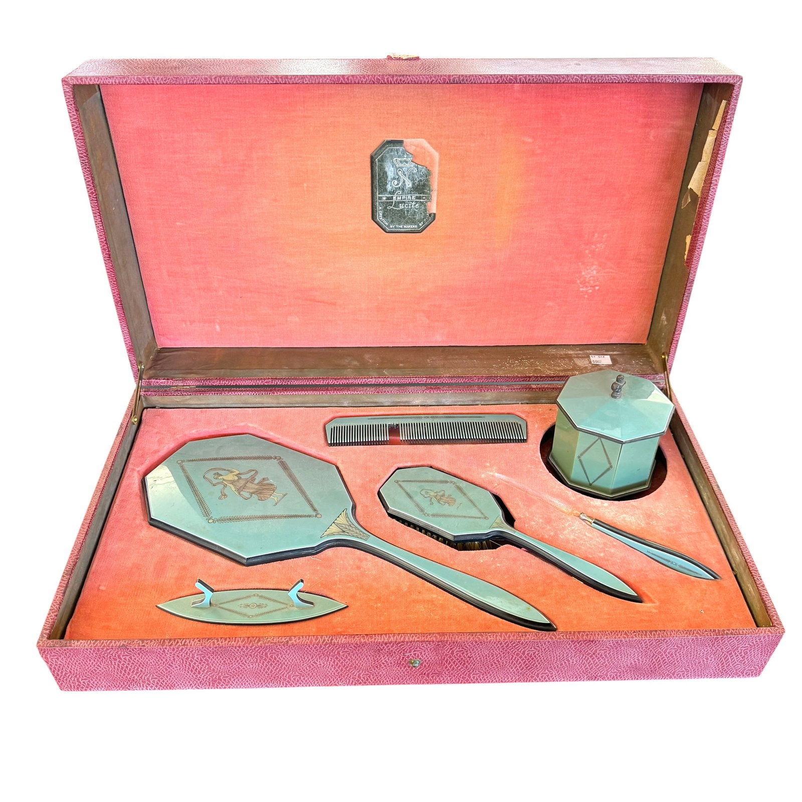 Vintage Celluloid Vanity Dresser Set in Presentation Case: A vintage mid-century vanity dresser set presented in its original satin and velvet-lined presentation box. The set features a geometric Art Deco style design in a celadon colorway. Set includes hand 