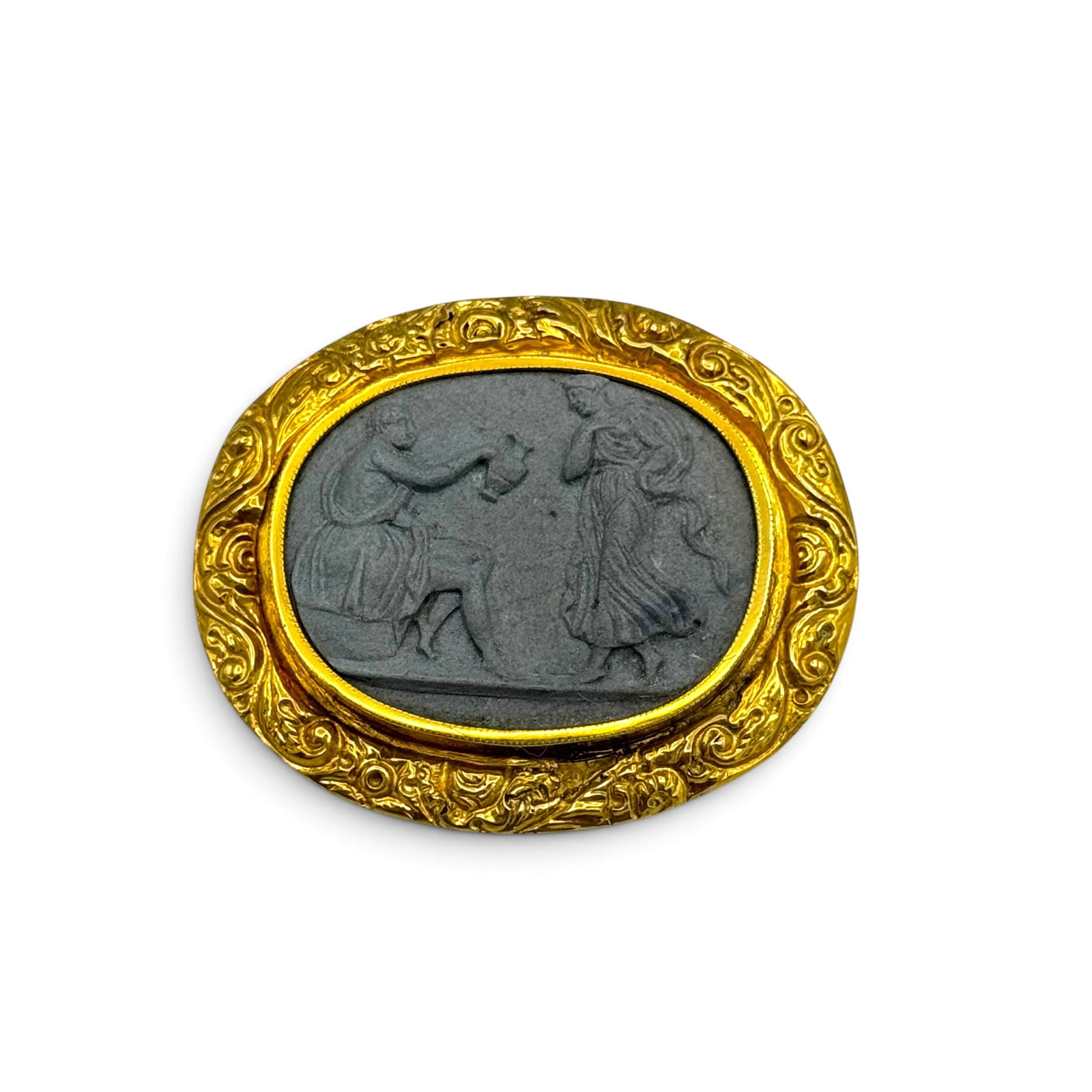 Lava Cameo, 14k Yellow Gold Brooch: Centering an oval lava cameo depicting Hercules and Hebe, set in a 14k yellow gold, repousse pin mounting measuring approximately 1.85 x 1.55 inches. Gross weight: 10.7 grams.