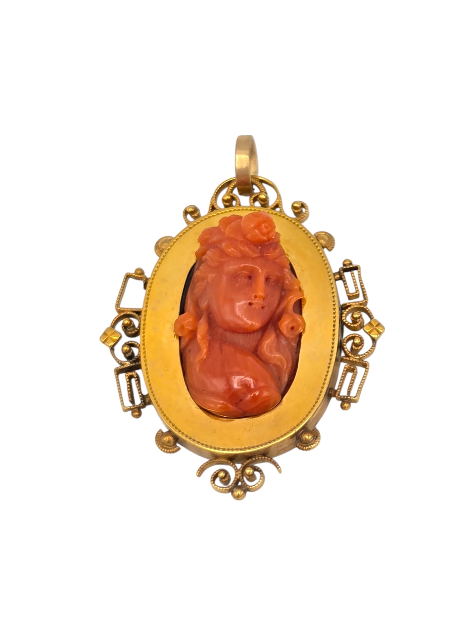 Victorian Coral Cameo, 14k Yellow Gold Pendant: Centering a high-relief coral cameo depicting the goddess Flora, set in a 14k yellow gold pendant measuring approximately 2.00 x 1.50 inches. Gross weight: 11.5 grams. Item condition: small piece of w
