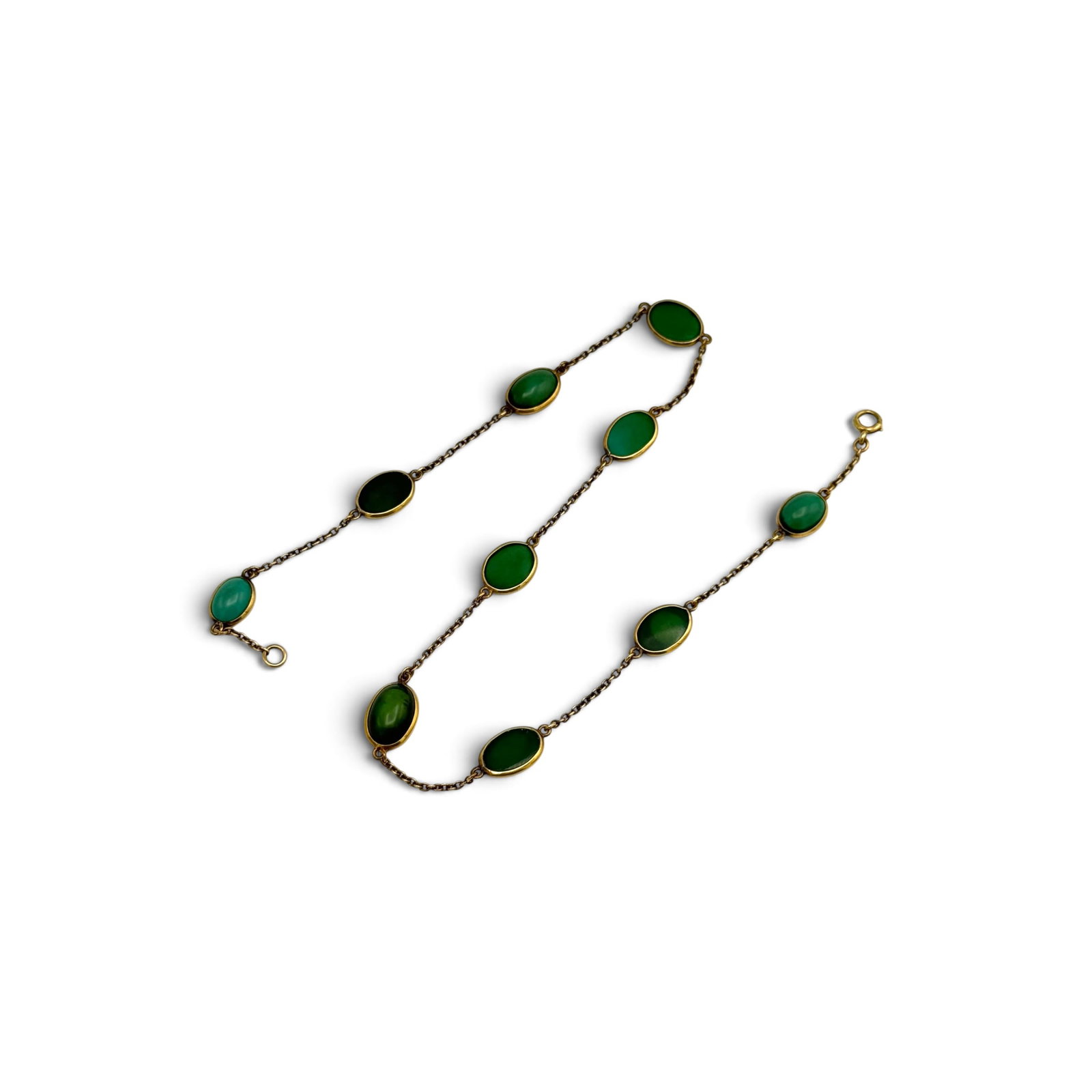 Turquoise, 14k Yellow Gold Station Necklace: Featuring ten oval turquoise cabochons, each measuring approximately 12.0 x 8.0 to 10.0 x 6.5 mm, joined by 14k yellow gold cable link chain and completed by a spring ring clasp forming a 15 1/2 inch
