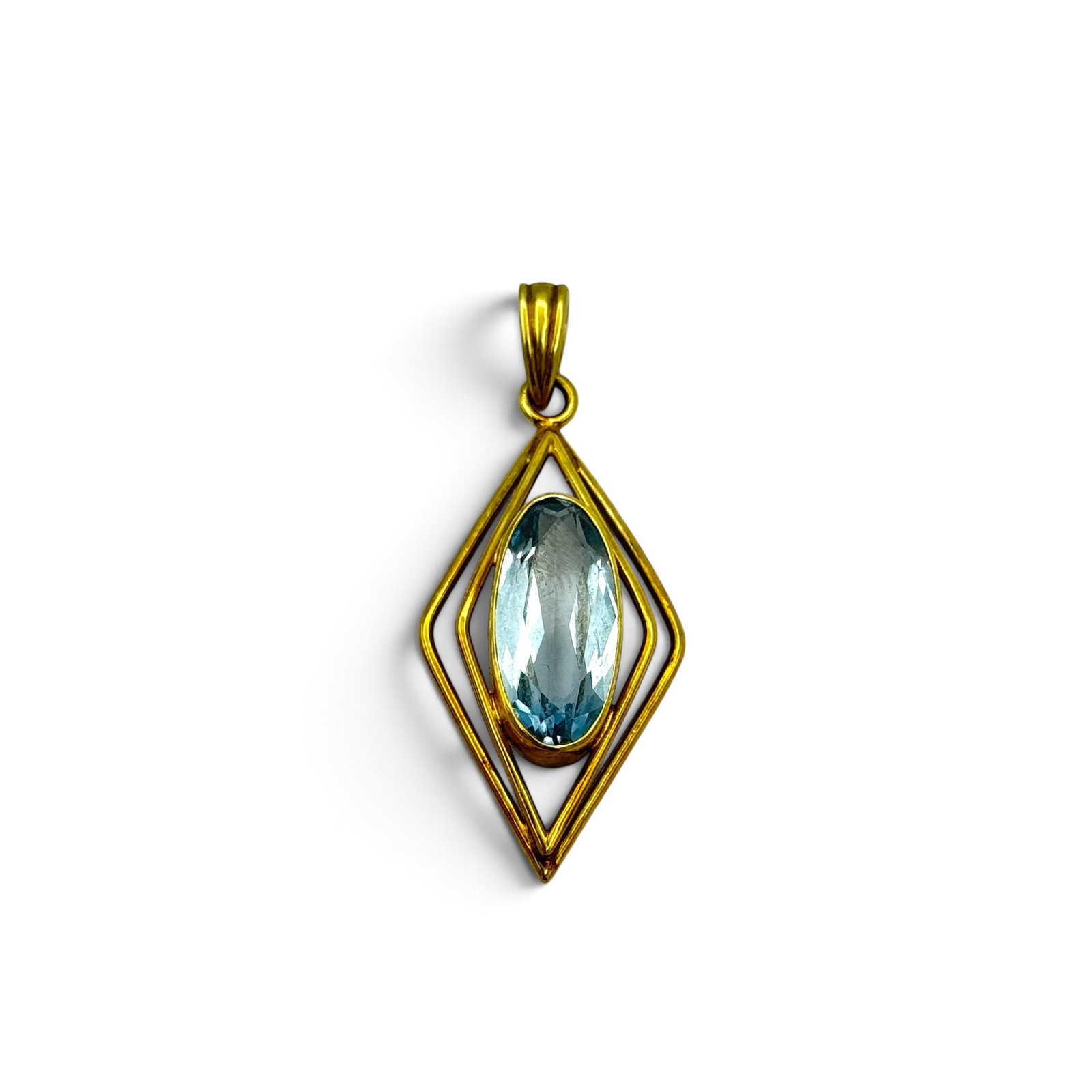 Vintage Synthetic Spinel, 14k Yellow Gold Pendant: Featuring an oval-cut synthetic spinel measuring approximately 17.73 x 8.26 mm, set in a 14k yellow gold pendant mounting measuring approximately 1.70 x 0.70 inches. Gross weight: 4.6 grams.