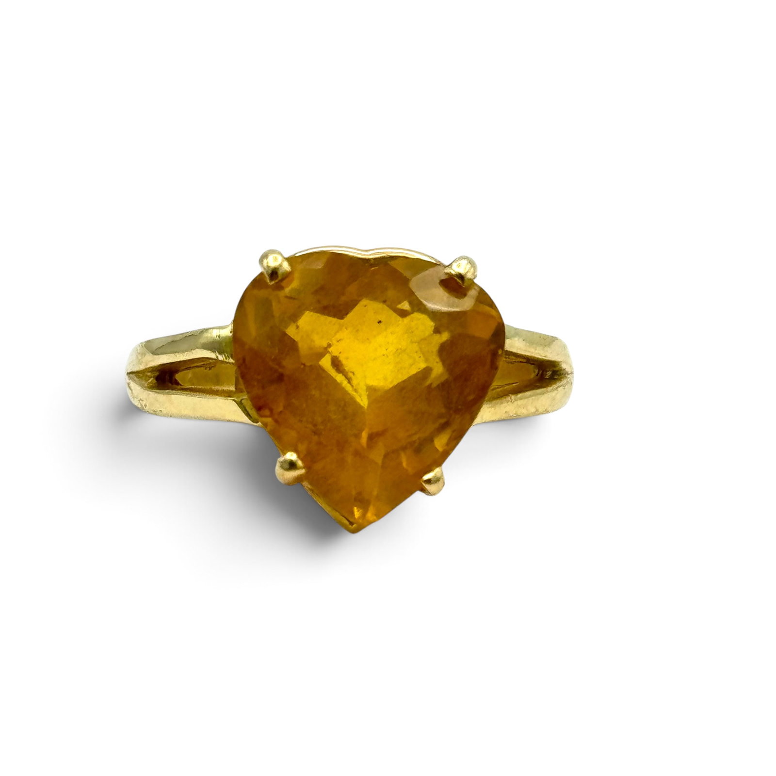 Citrine, 14k Yellow Gold Ring: Featuring one heart-shape citrine weighing approximately 5.46 cts., set in a 14k yellow gold ring mounting, size 6 3/4. Gross weight: 5.6 grams.