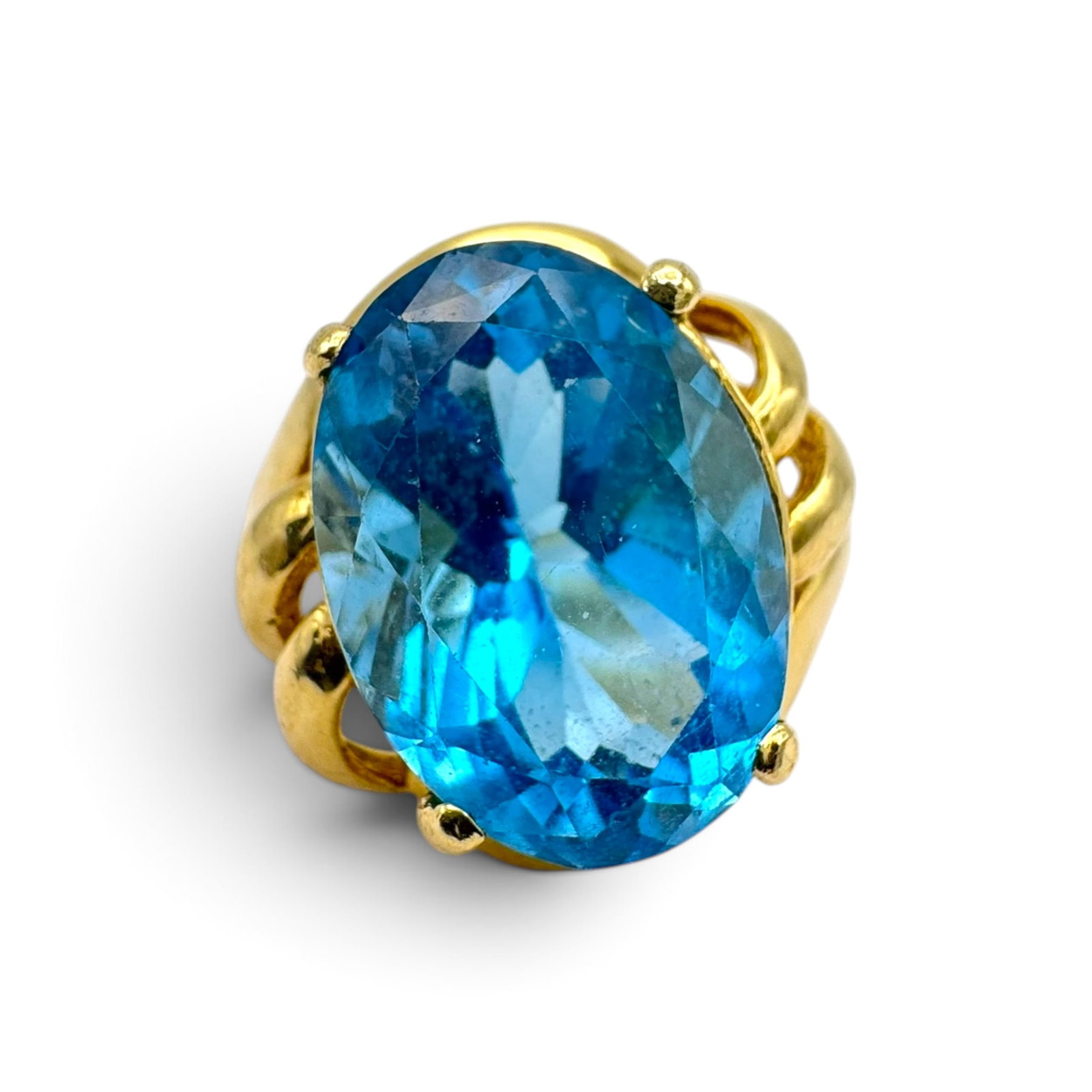 Topaz, 14k Yellow Gold Ring: Featuring one oval-cut blue topaz weighing approximately 8.54 cts., set in a 14k yellow gold ring mounting, size 6 1/4. Gross weight: 5.8 grams.
