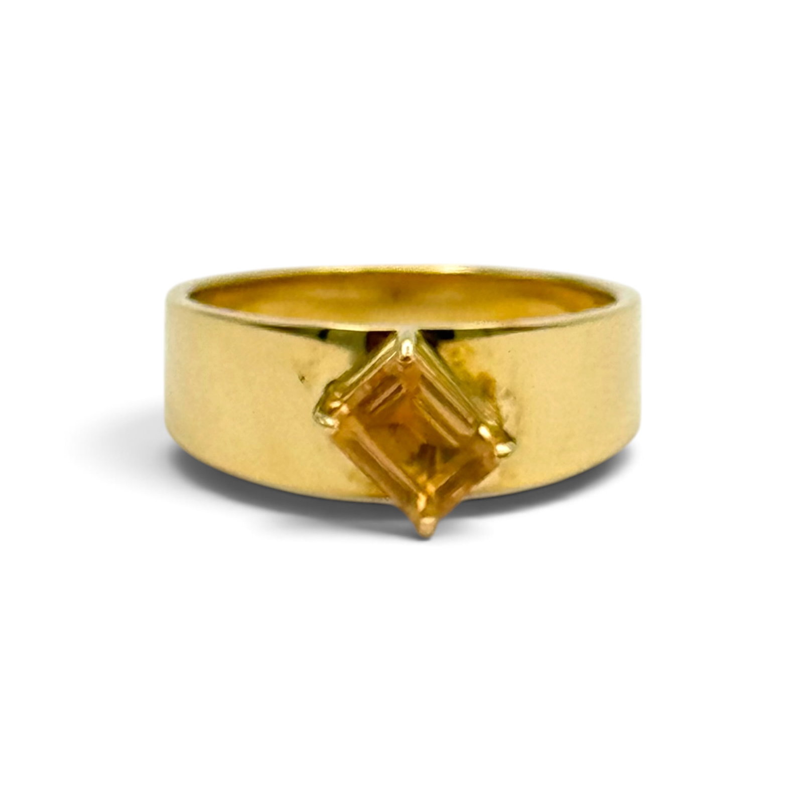 Topaz, 14k Yellow Gold Ring: Featuring one rectangular step-cut topaz weighing approximately 1.65 ct., set in a 14k yellow gold ring mounting, size 9 1/2. Gross weight: 6.5 grams.