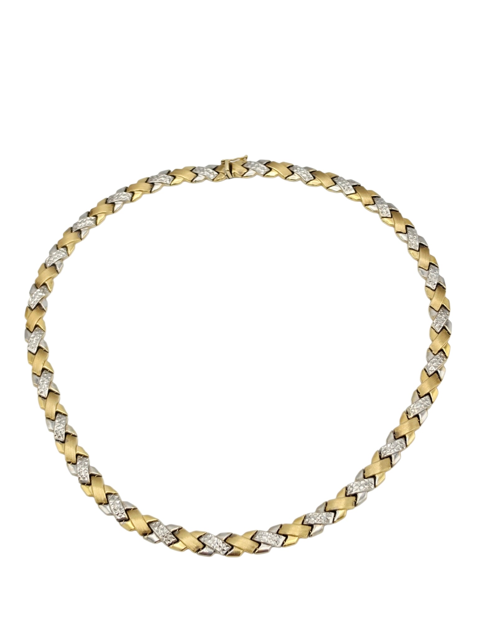 14k White and Yellow Gold Necklace: The 14k bright-cut white gold 'X' links interspaced by yellow gold, completed by a push-button tongue-and-groove clasp with figure eight safety forming a 16 inch necklace. Gross weight: 22.2