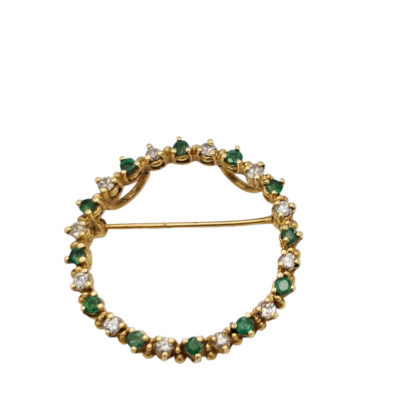 Diamond, Emerald, 14k Yellow Gold Circle Pin Pendant: Featuring twelve round brilliant-cut diamonds weighing a total of approximately 0.36 ctw., alternating with twelve round-cut emeralds weighing a total of approximately 0.36 ctw., set in a 14k yellow