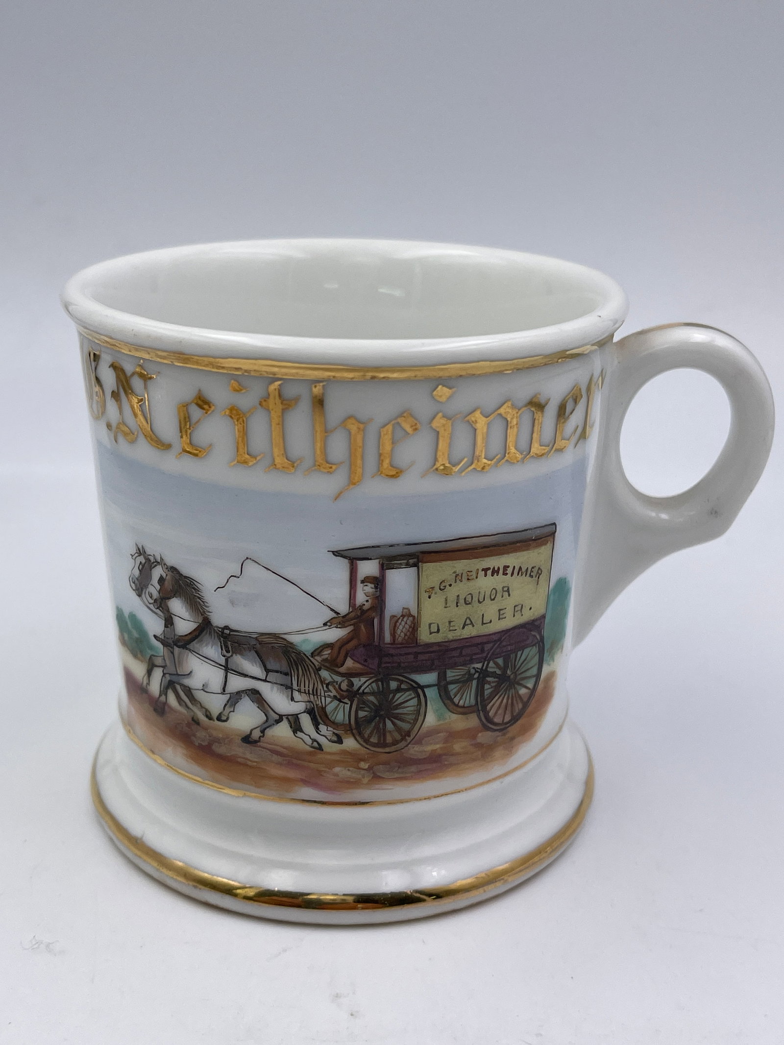 Liquor Dealer Porcelain Occupational Shaving Mug: Name reads T. G. Neitheimer. Ht: 3.5"
