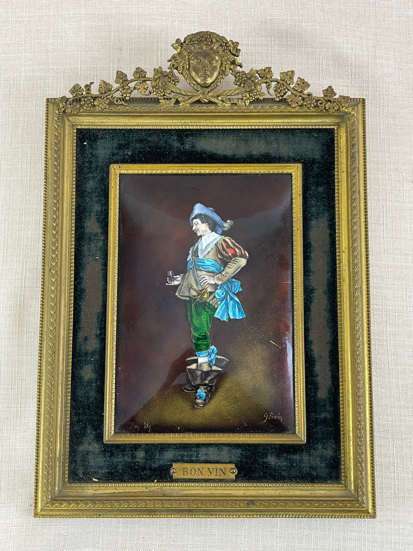 J. Brurin, "Bon Vin": Painted enamel. Brass frame.Image measures: 6.5" H x 4.5" W