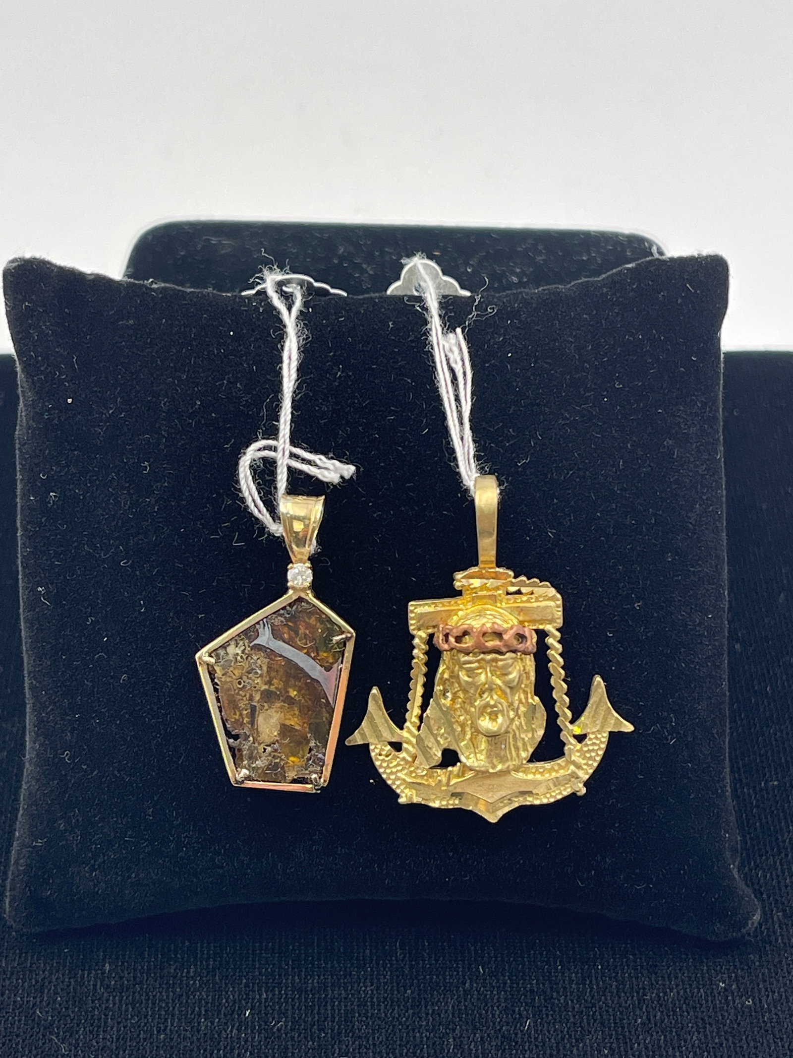 14K Gold Meteorite & Gold-Plated Pendants: Meteorite with a diamond chip pendant Wt: 3.3g. Jesus Christ pendant Wt: 6.5g. Length: 1.5". Purchases of silver, gold, or jewelry made by new buyers must be paid by certified bank check, wire transfe