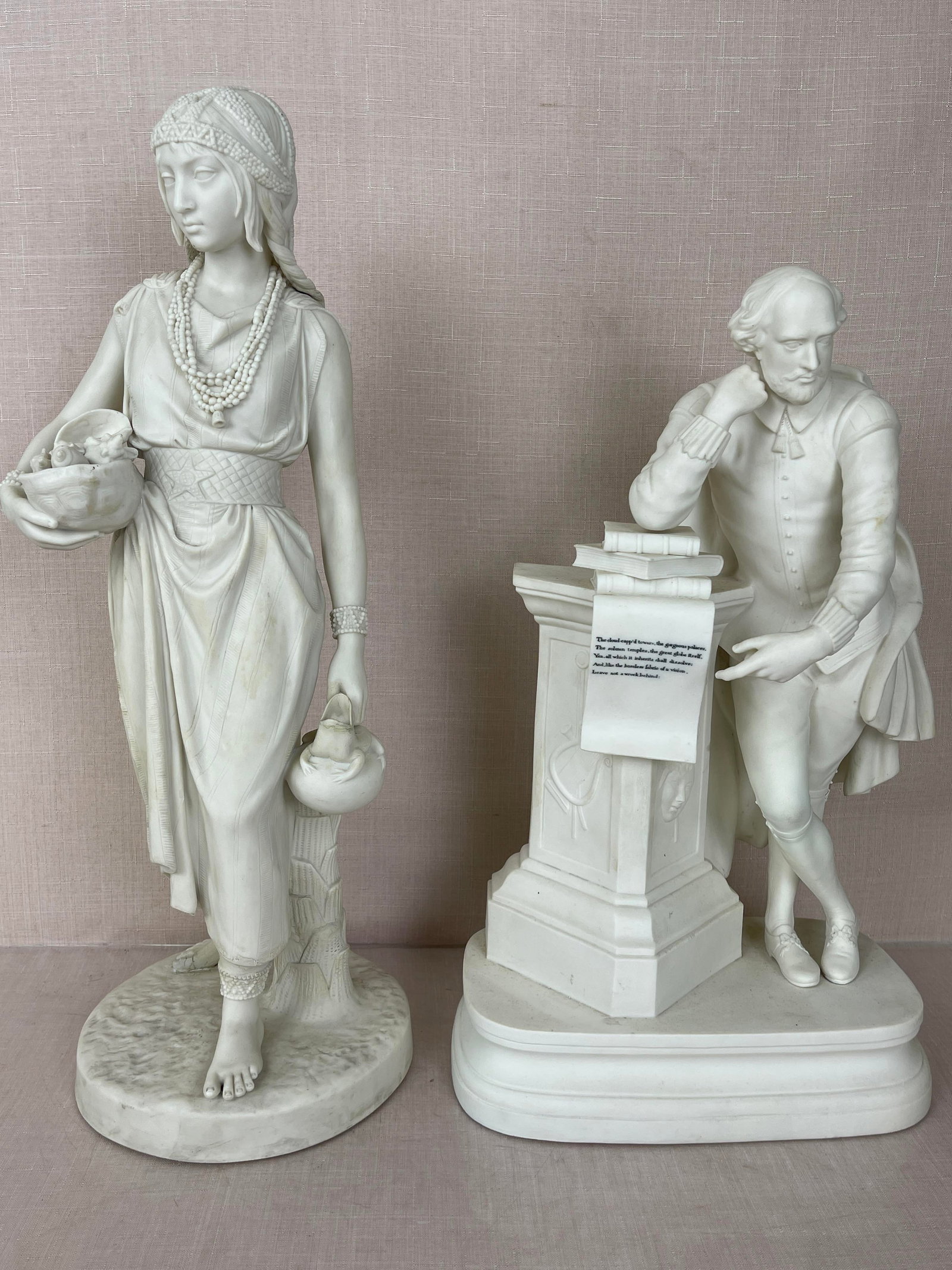 Parian Statue of a Woman and Shakespeare: The woman has some discoloration and damage. Shakespeare has some discoloration, but appears to be in good condition. Woman's Ht: 21"