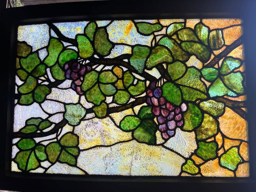 Antique Tiffany-Style Grapevine Stained Glass Window: Warped, and one of the panes is cracked. Without frame: 20.5" x 31.5"