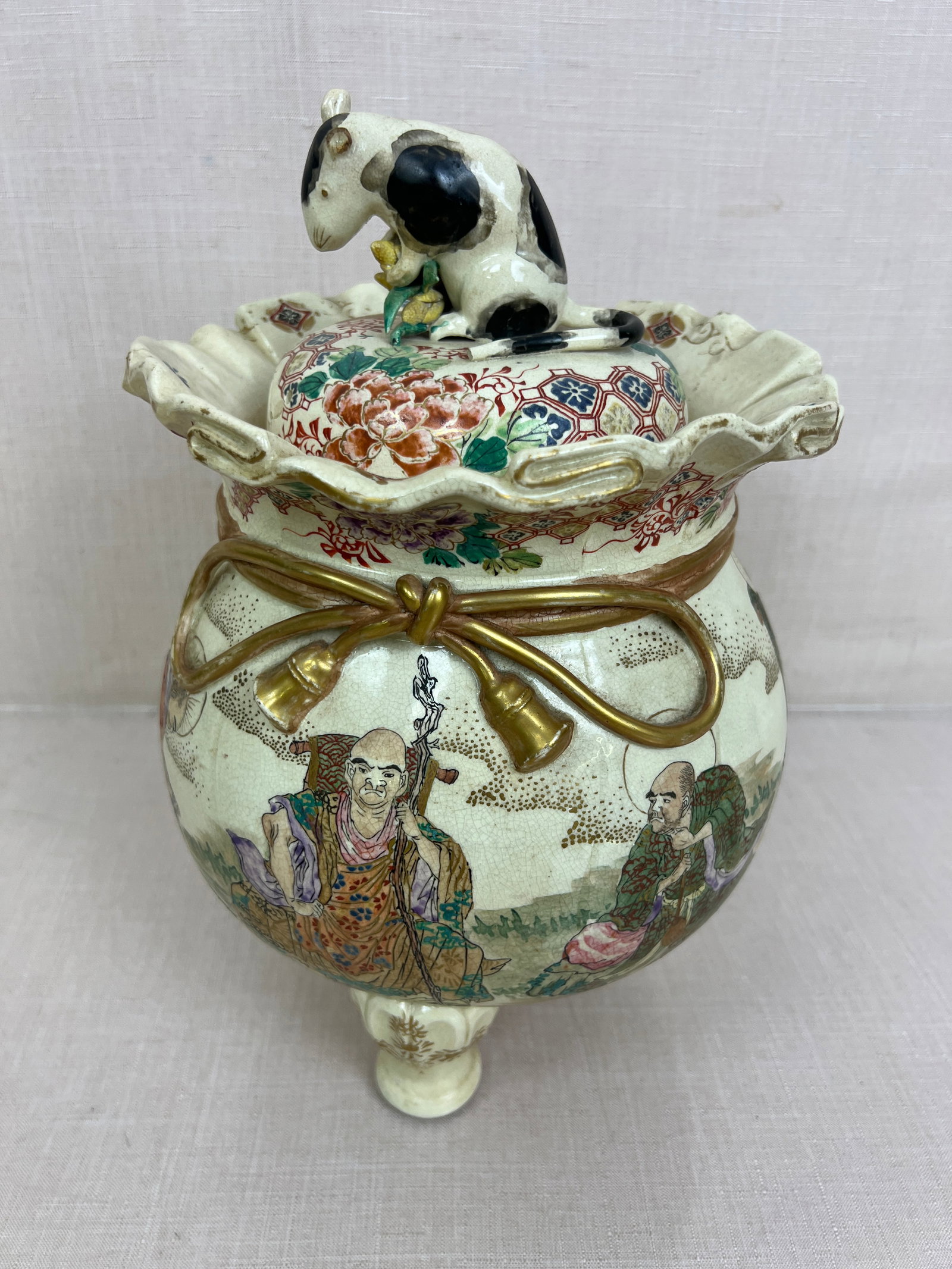 Japanese Satsuma Porcelain Footed Jar: Has some cracks and a hole in the top, the ear of the rat is broken off and also has a crack. Ht: 12"