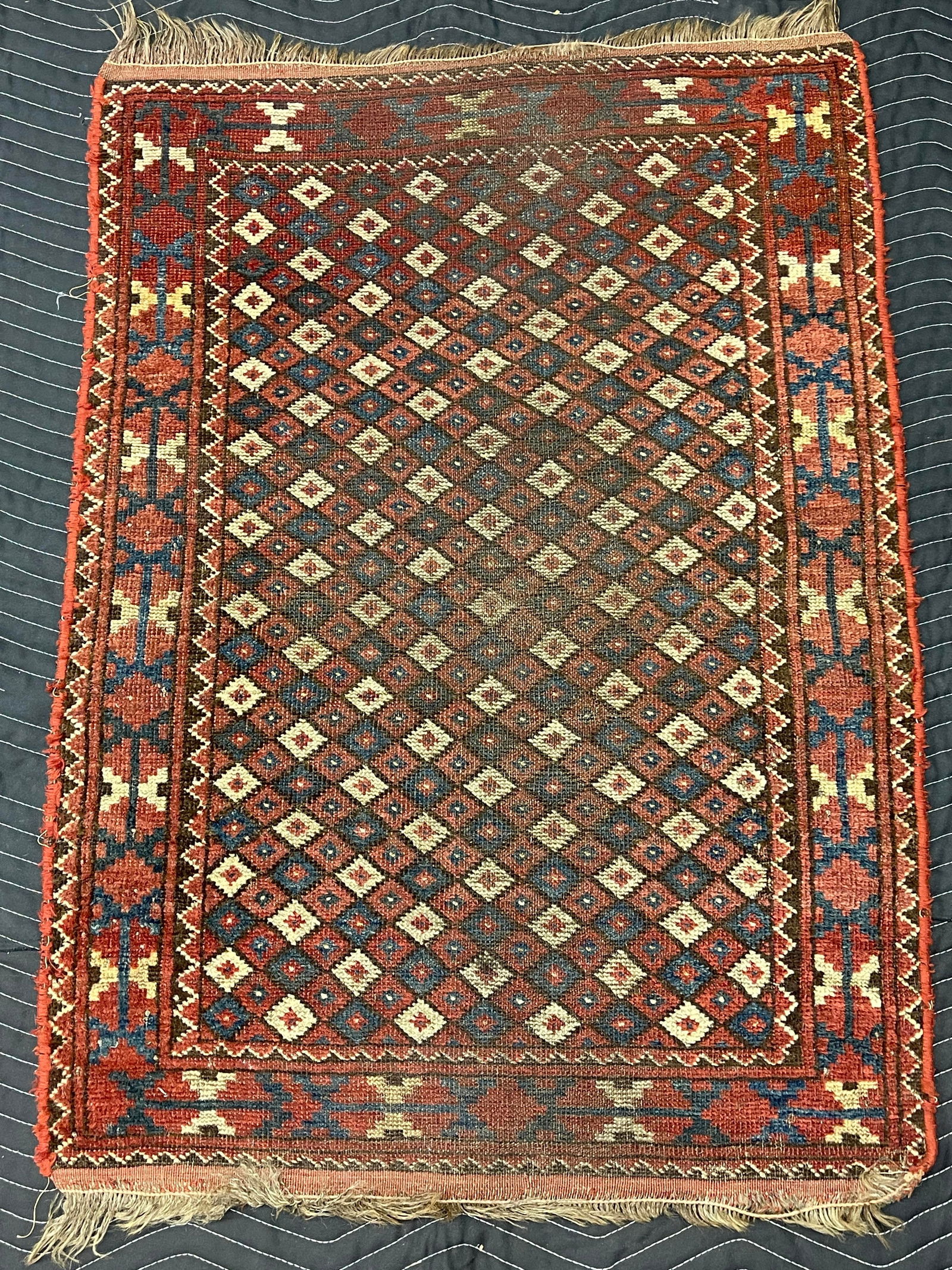 Antique Caucasian Persian Afghan: Wear to pile, some discoloration. 41" x 31"