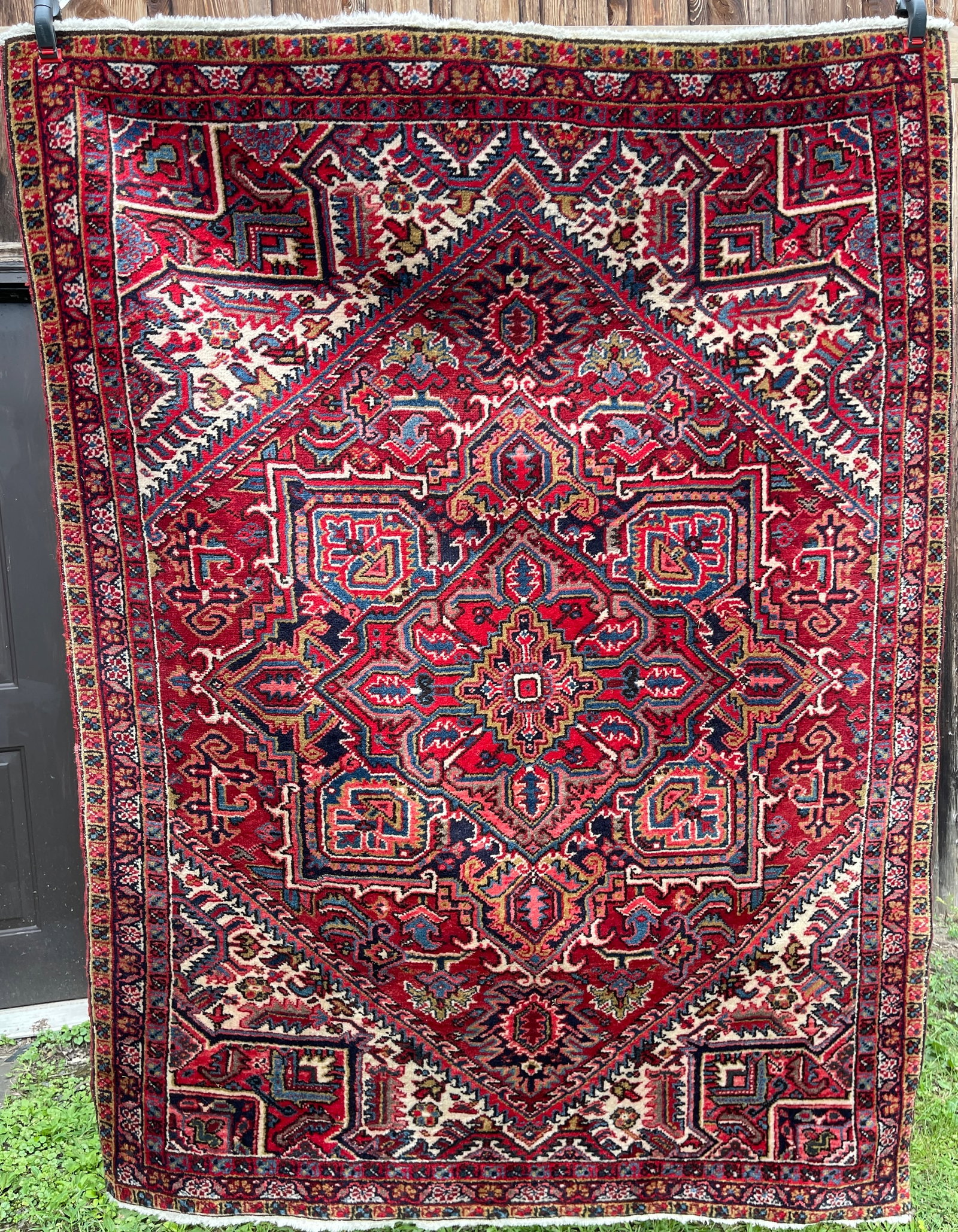 Vintage Heriz Area Rug: Good condition, no significant damage.6'6" x 4'10"
