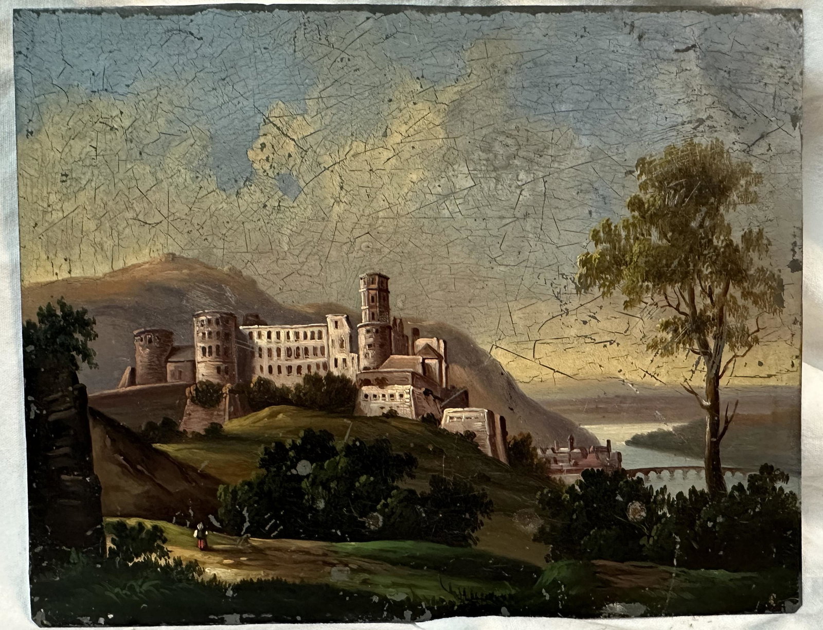 Painting of a Castle / Walled Village overlooking a River on Metal: Beautiful image of a castle or walled village overlooking a river and bridge on tin. Painting I estimate would be at least early 19th century if not 18th century. Colors still show bright in areas.Dim