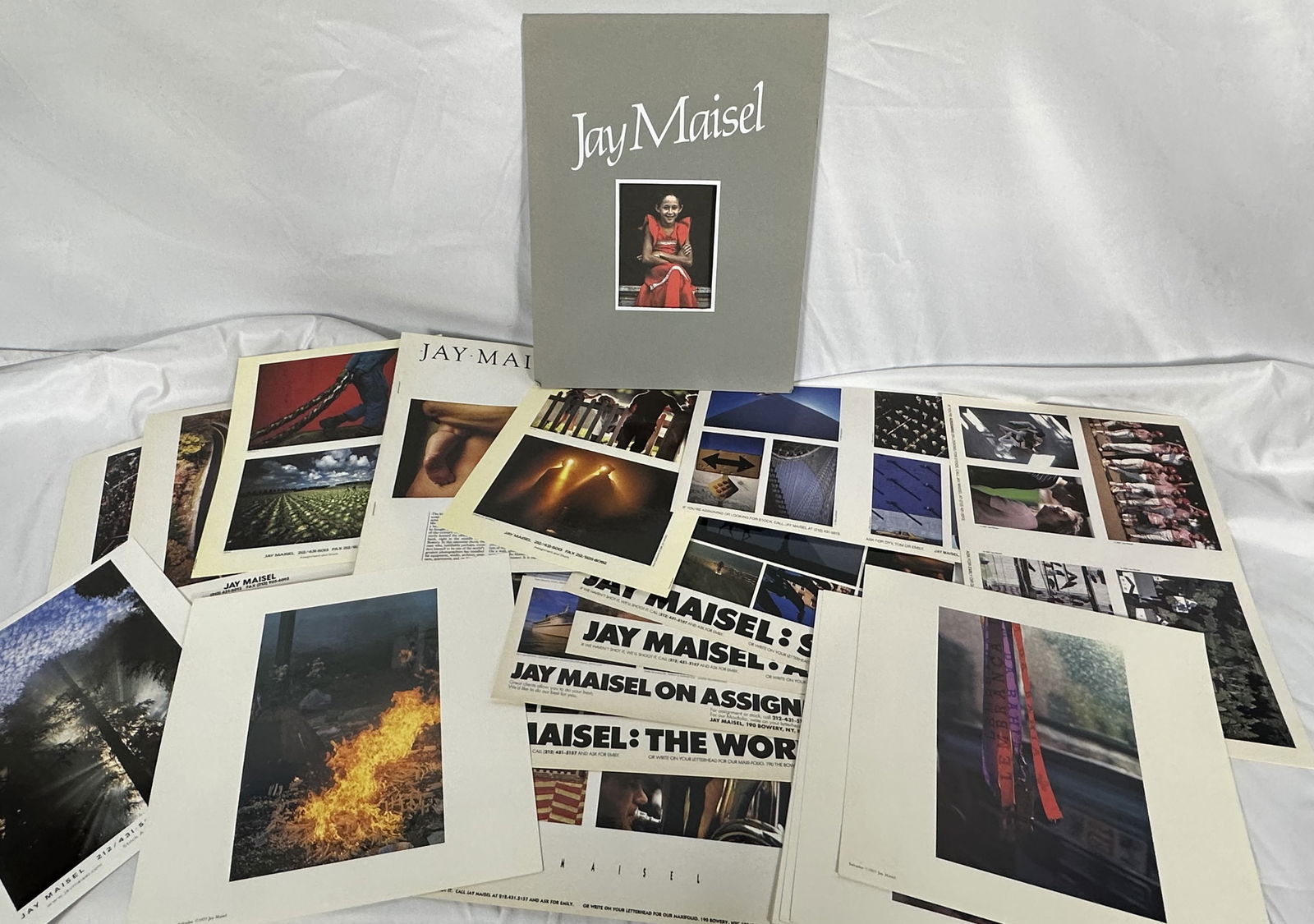 Jay Maisel Portfolio and Photographic Prints: This lot consists of a large group of photographic posters as well as a Jay Maisel portfolio.Jay Maisel began his photography career in 1954. While his portfolio includes the likes of Marilyn Monroe a