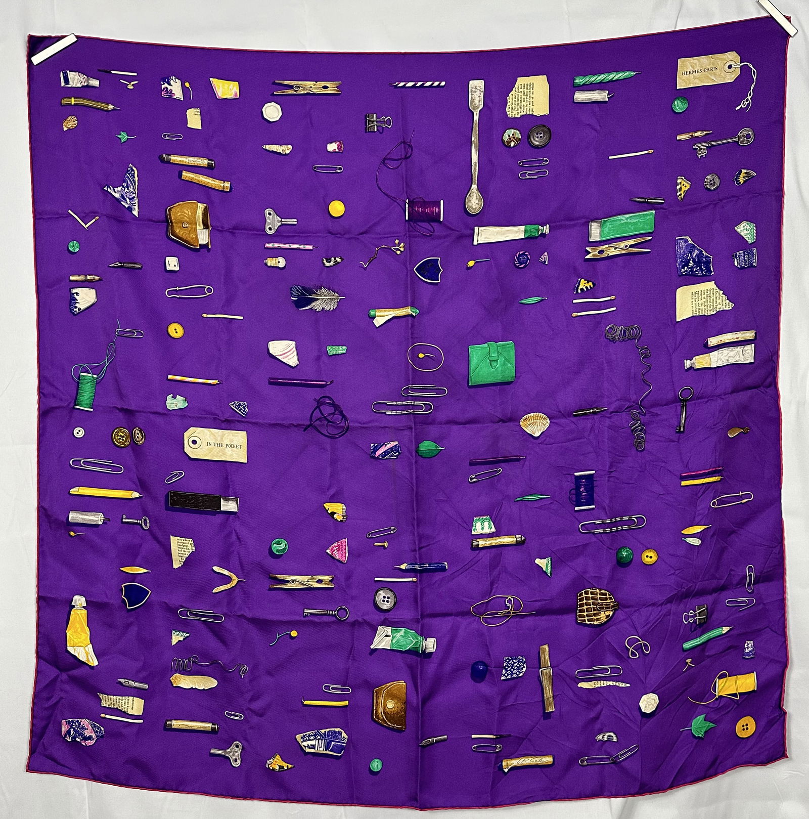 Hermes Scarf - In The Pocket 90cm Silk Scarf With Box: An original Hermes In The Pocket 90 cm silk scarf. This scarf is adorned with images of all the odd and magical things we find in our pockets from day to day. Comes with original box as shown