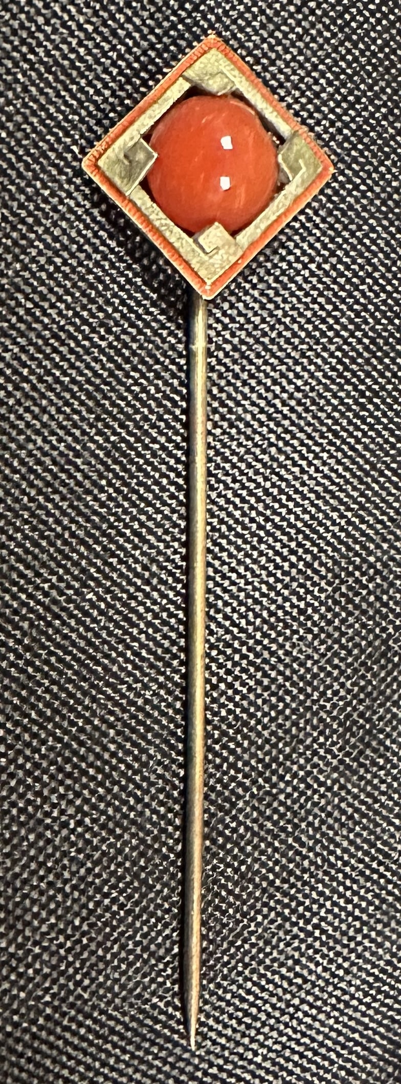 14k Yellow and White Gold Stick Pin with Carnelian Bead: A 14k yellow and white gold stick pin with head having a Greek key design, enamel border and carnelian bead. Stick pin weighs 2.6 grams.