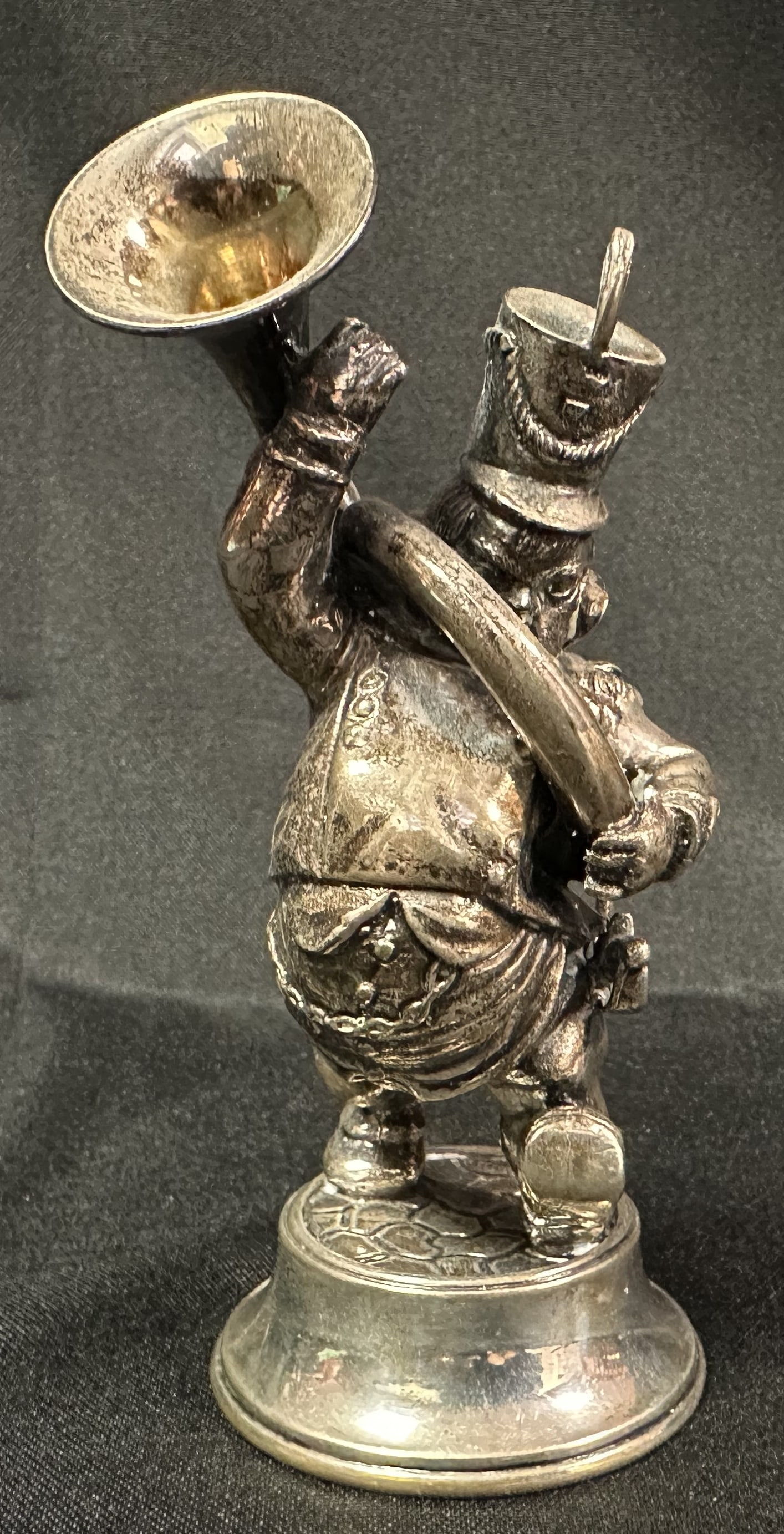Silver Figure of a Horn Player: Silver figure of a marching band Tuba player.