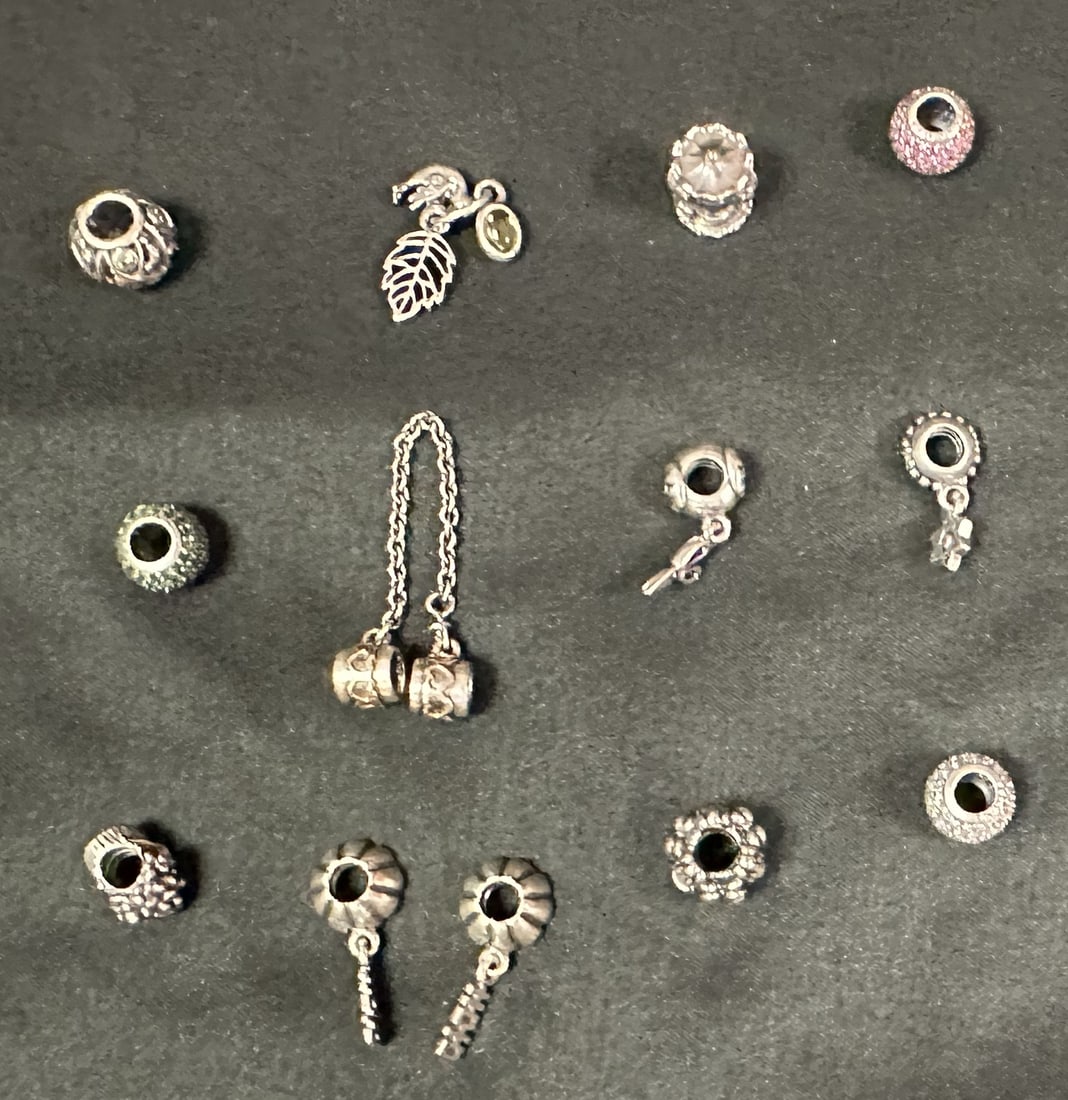Pandora 12 Charms Retired, with Gold, Nice Selection Group 1: Interesting group of 12 Pandora charms, some retired and some with gold. See below for the individual names:Double Happiness Dangle CharmsBirthday Bloom with HematiteClear Pave LightsHearts with Safet