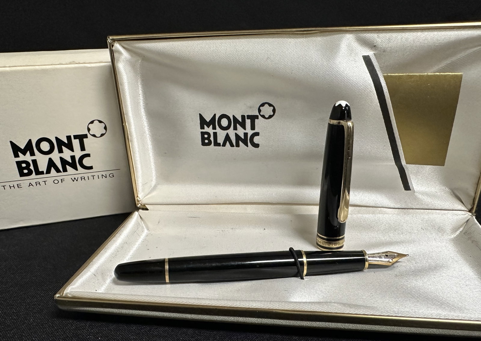 Montblanc 164 Two Tone 14k Nib Pen with Box: A Mont Blanc 164 fountain pen with a fine 14k two-tone yellow and white gold nib in the original box with warranty card. Mont Blanc is world reknown for it's quality and this vintage example matches o
