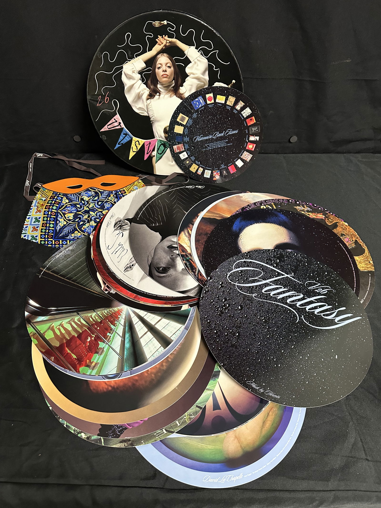 Visionaire 26 Fantasy with Hermes Scarf Mask: Fantasy is the subtext of every issue of Visionaire, but with 26 FANTASY we pushed the boundaries to the fantastical. A round box houses round, unbound artwork. Each of the cover elements ? photograph