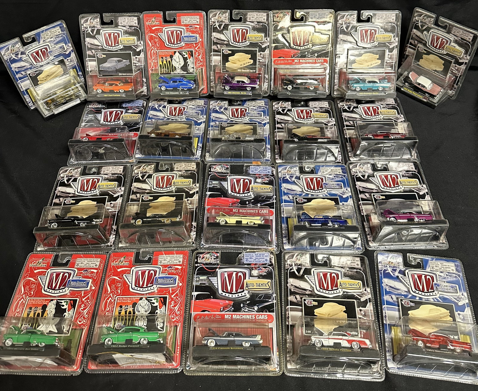 22 Toy Cars Mint/Sealed M2 Machines: Group of 22 replica toy cars in 1:64 scale all mint / sealed in their packaging.