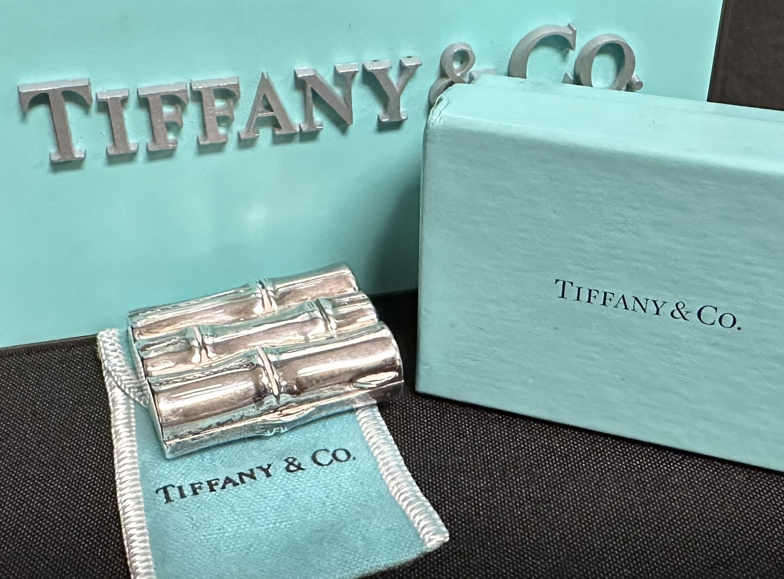 Tiffany Sterling Silver Pill Box Bamboo Design: Fun sterling silver Tiffany and Co bamboo form pill box. One of a line of uniquely formed pill boxes by Tiffany and Co that has spawned legions of collectors of these little jewels. This one comes in