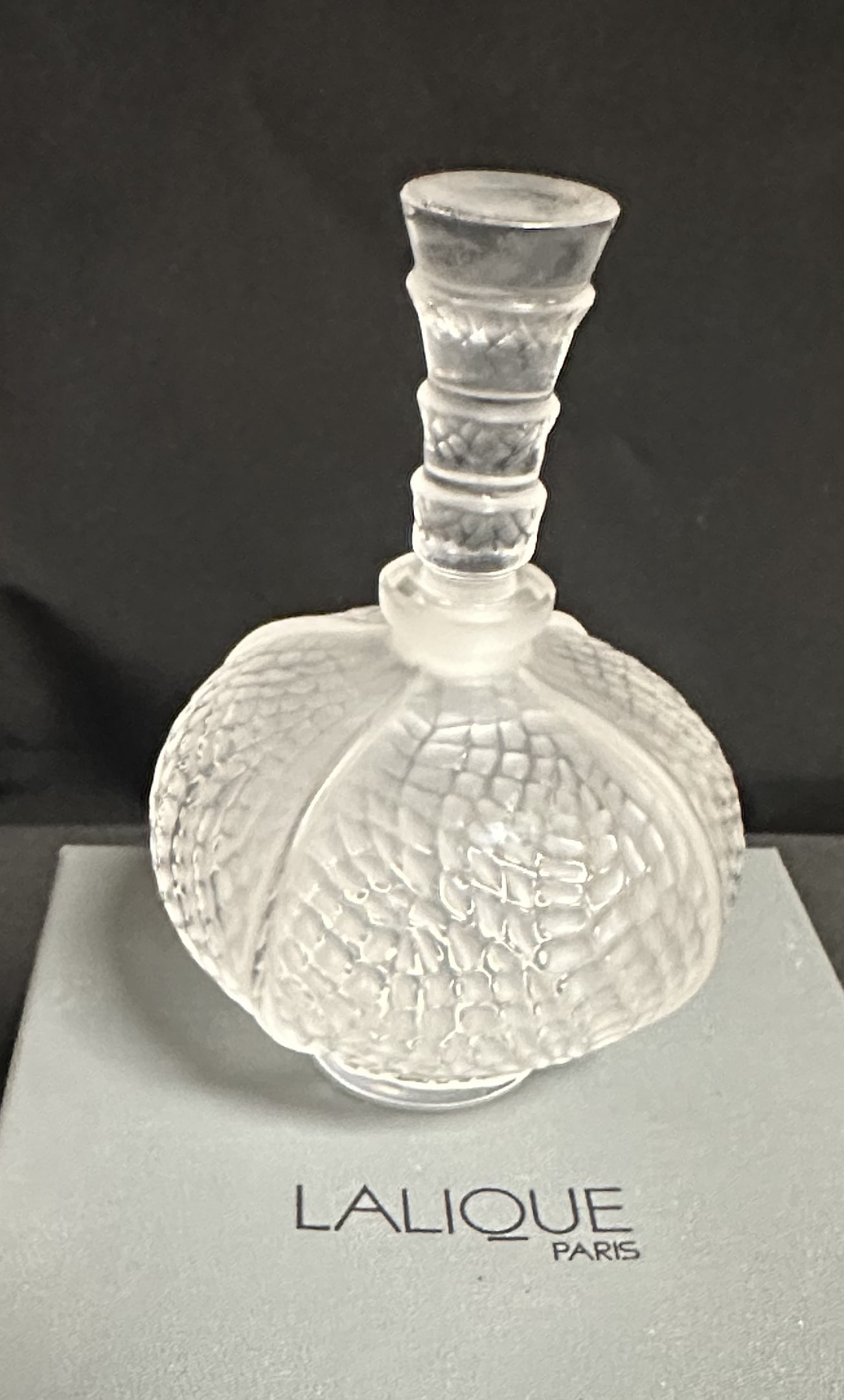 Lalique 4 7/8 Inch Palmette Perfume Bottle with Box: The Lalique Palmette perfume bottle was designed by Maria-Claude Lalique (Ren?s granddaughter), and first released c1997. It is no longer in production. In good condition as you can see and also comes