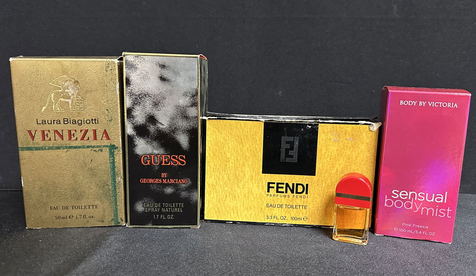 Group of Five Designer Perfumes, Guess, Fendi, etc: Nice group of designer perfumes including Guess, Fendi, Laura Biagattis Venezia, Body by Victoria and Elizabeth Arden.