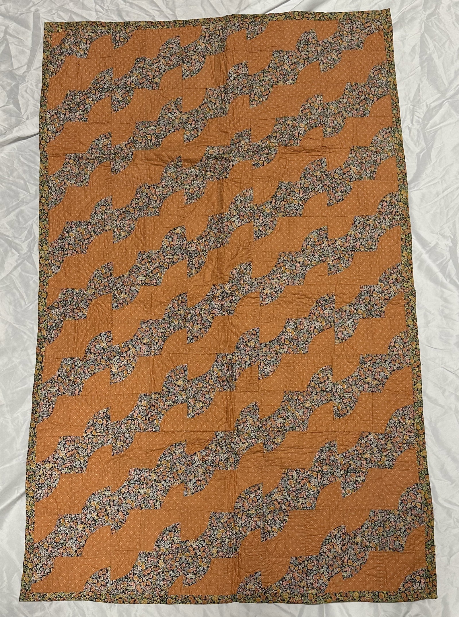 Vintage Floral Motif Quilt with Interesing Floral Backing: Floral motif quilt measuring about 57 inches by 35 inches. Well executed with attractive floral backing.