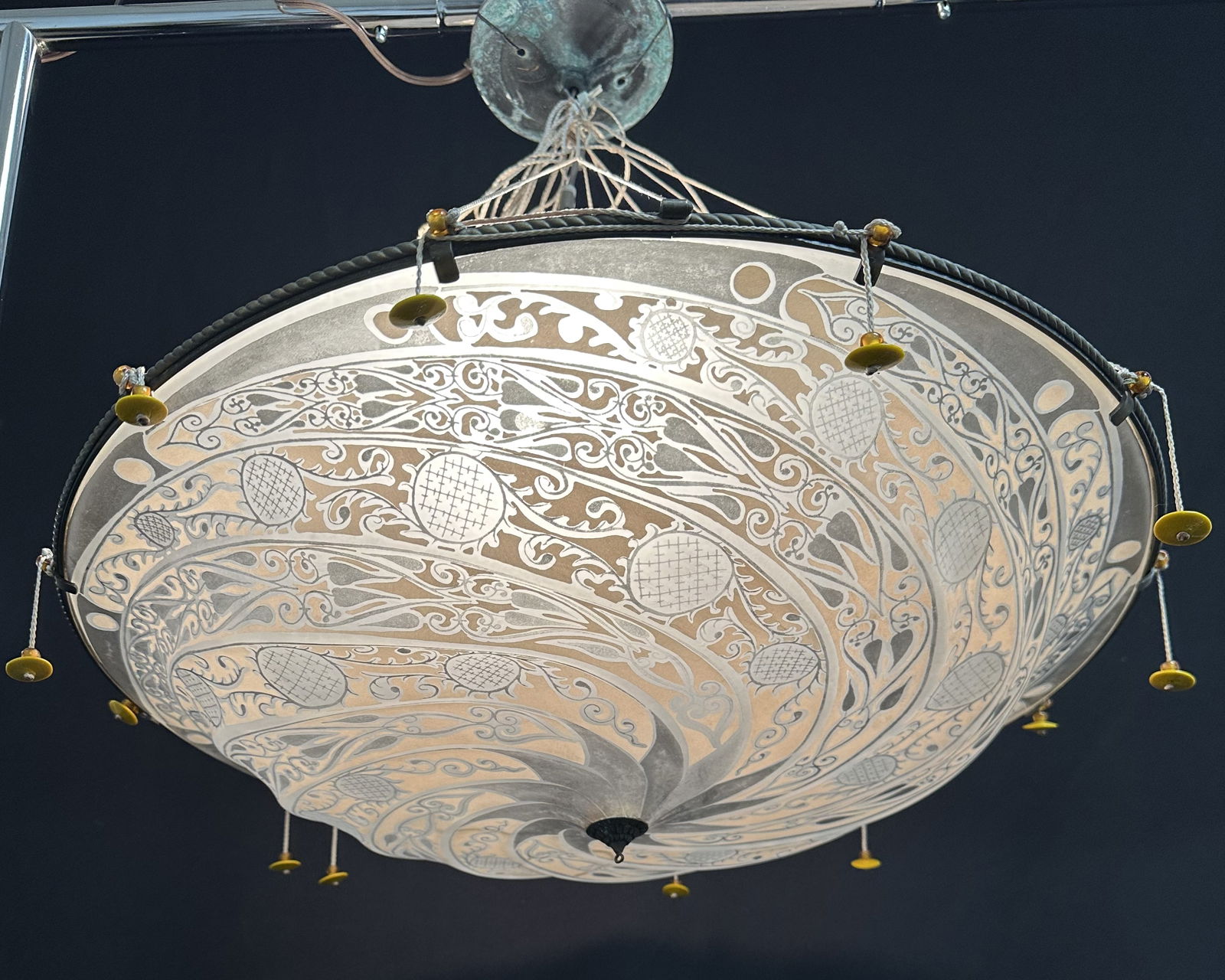 Large Vintage Mariano Fortuny Glass and Tassle Scudo Saraceno Pendant Light: Scudo Saraceno Glass Pendant Designed by Mariano Fortuny The Scudo Saraceno Glass Pendant is inspired by the Saraceno Shield from Medieval times. The glass is complemented by striking details with a b