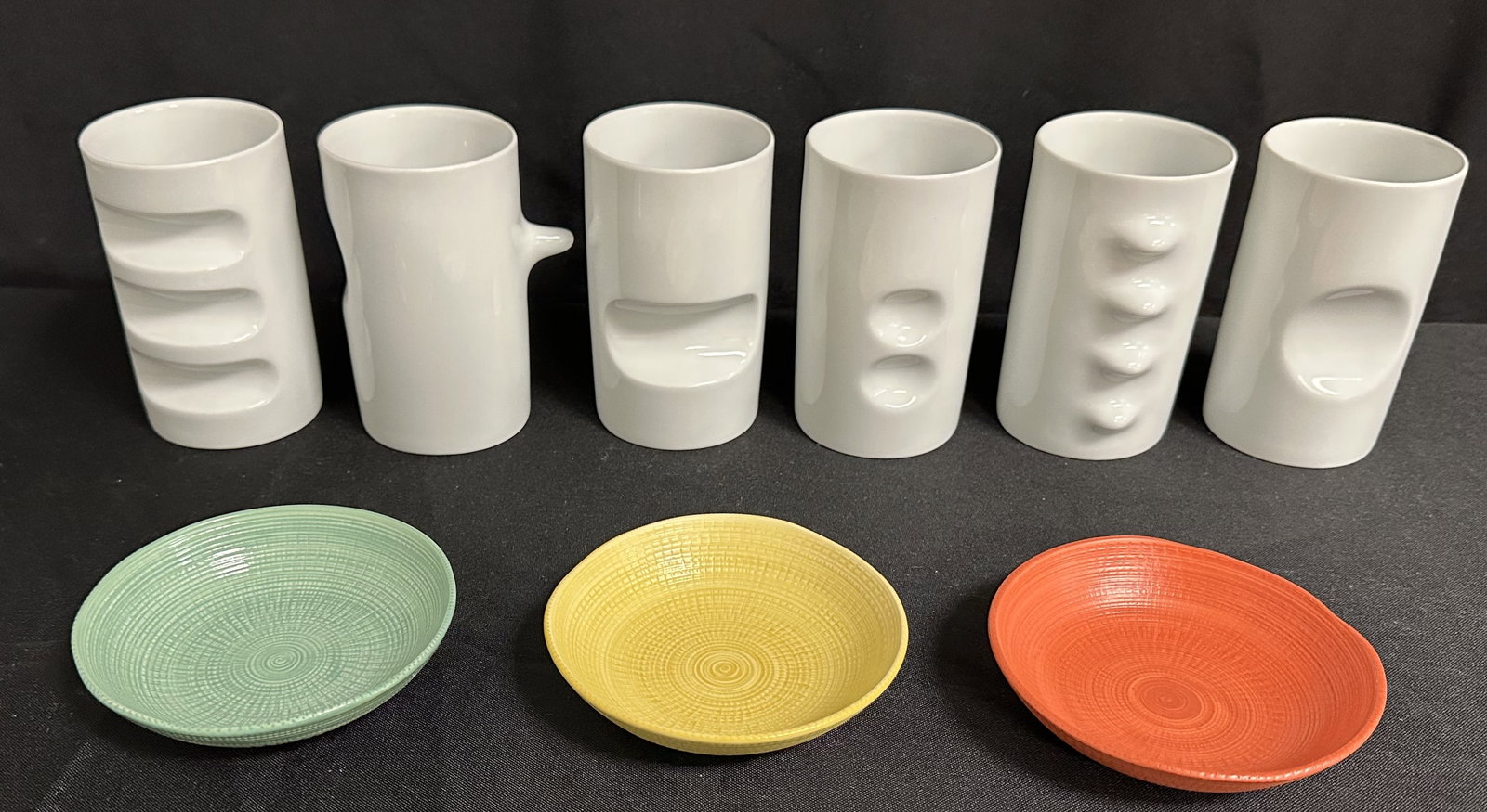 Group of Hakusan Japanese cups and dishes: Set of six fancy drinking cups designed by Masahiro Mori, the Fancy Cups is an undeniably unique set of six porcelain white cups, each with a different pattern that fits into your hand. An art piece, 