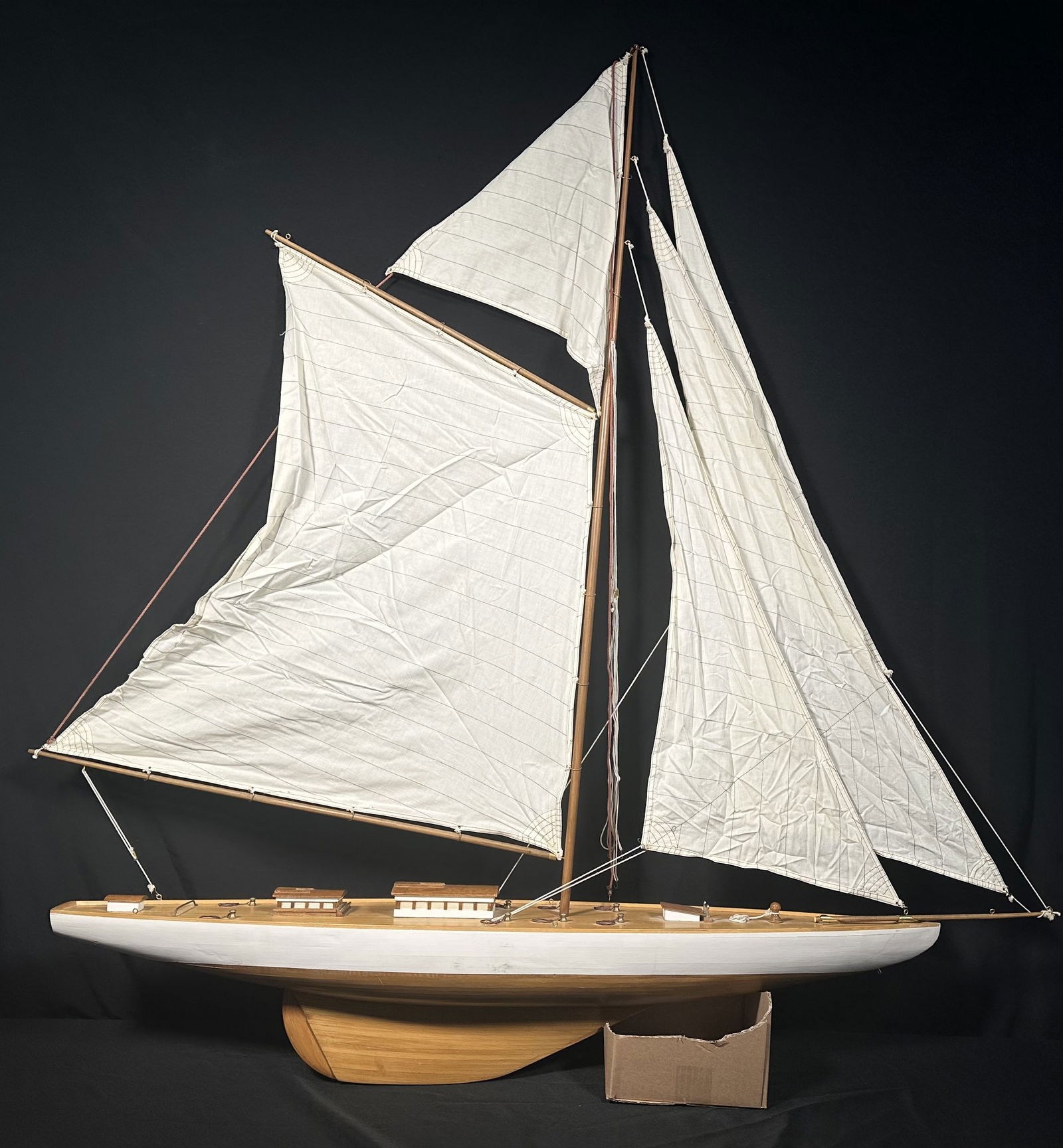 Large Hand Assembled Wood Sail Boat 56 Inches Long, 60 Inches Tall: Large wood sailbaot measuring 56 inches long and 60 inches tall at the top of the main sail. I'm sure I didn't rig this correctly but just wanted to put up all the sails so you can see (sort of) what