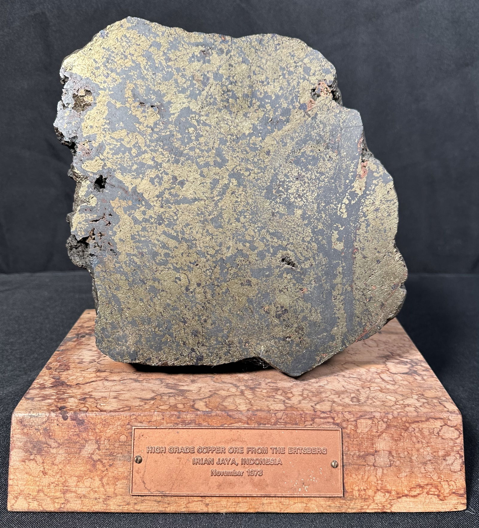 Copper Ore Sample on Stand: Copper Ore Sample on Stand A large presentation sample of high quality copper ore on stand from Indonesia in 1973. This was probably a gift to an executive when the mine opened.The Ertsberg mine, a m
