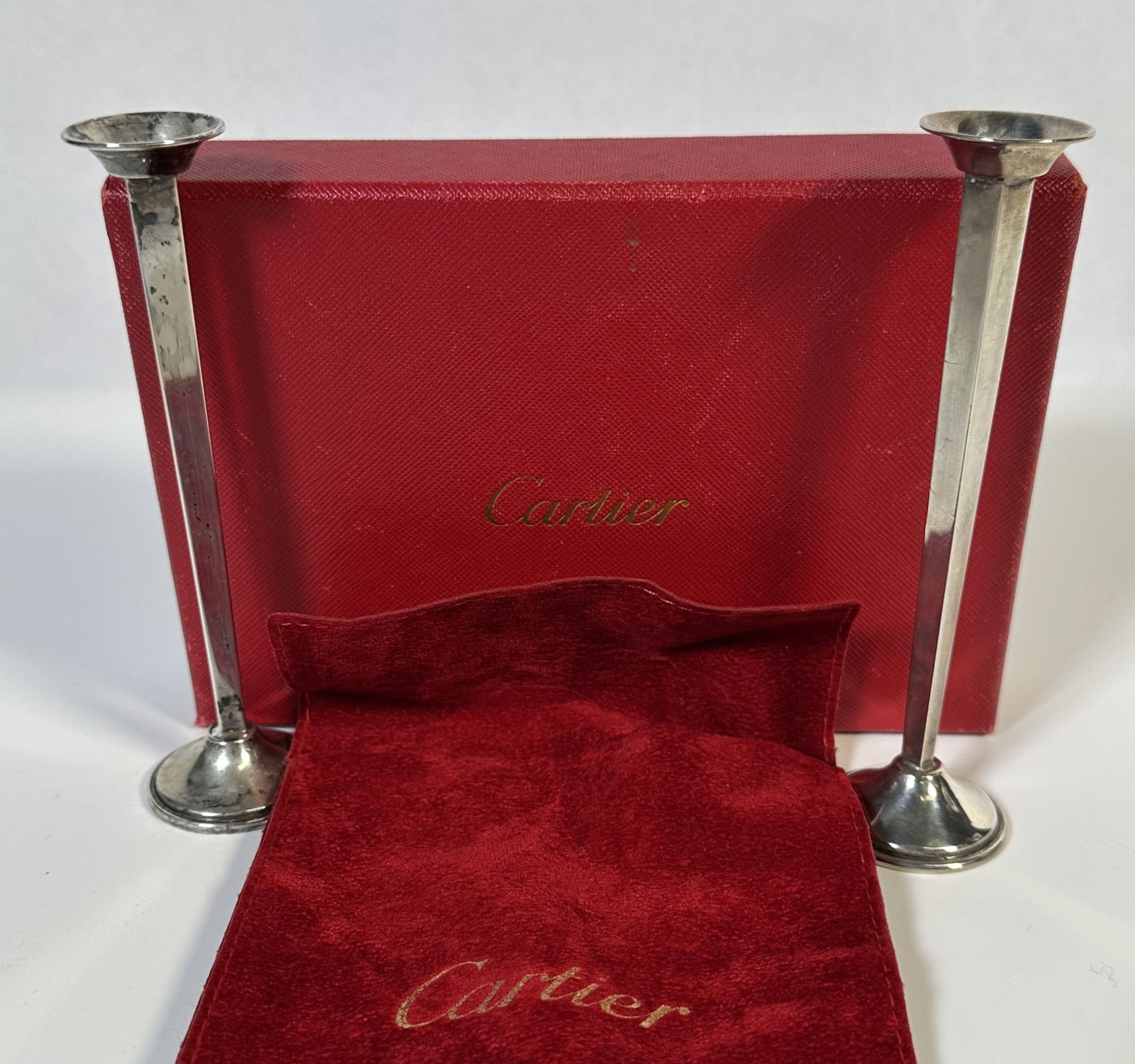 RR- Pair of Cartier Sterling Silver Bud Vases: RR- Pair of Cartier Sterling Silver Bud Vases >Pair of Cartier sterling silver bud vases with Cartier suede pouch and Cartier box. Each measures about 5 1/3 inches tall. These bud vases typically sell