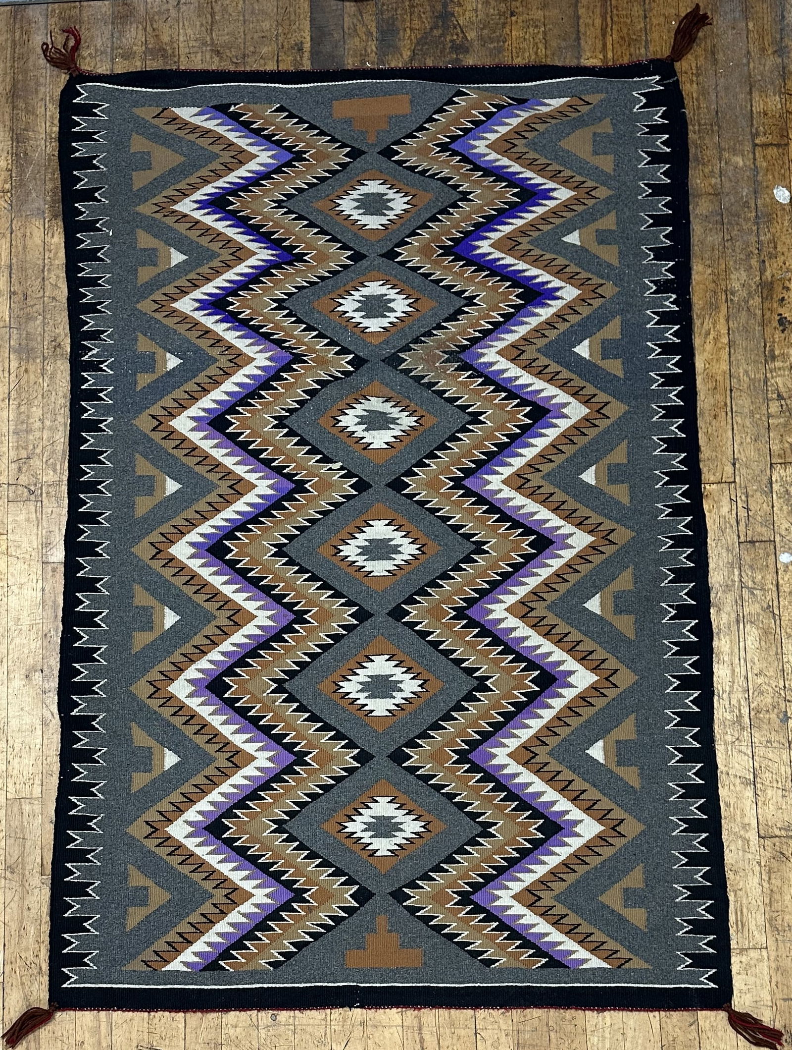 Teec Nos Pos Navajo Rug 62.5 x 41.5: Teec Nos Pos Navajo Rug 62.5 x 41.5 Attractive Navajo weaving in the Teec Nos Pos pattern. The community of Teec Nos Pos is in the central part of the chapter area. The Teec Nos Pos Chapter is part of