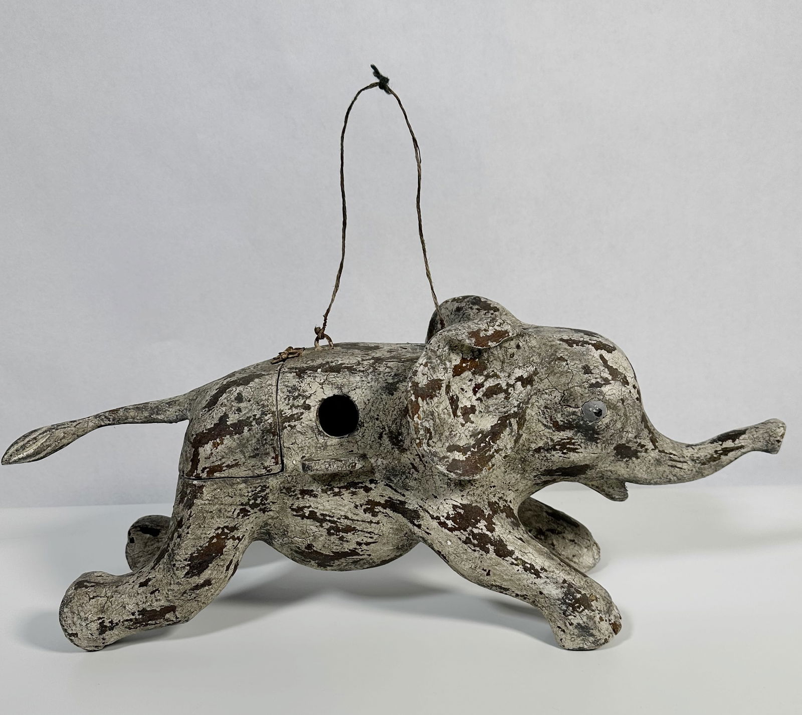 Vintage Distressed Wood Elephant Bird House: Vintage Distressed Wood Elephant Bird House Large older elephant form wood hanging birdhouse with distressed white paint. For this lot shipping can be done one of three ways:LiveAuctioneers Live Ship