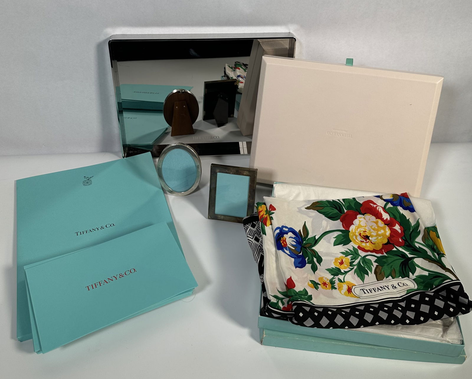 Tiffany Large Assorted Lot 2: Tiffany Large Assorted Lot 2 Large assorted lot of Tiffany items, some unavailable to the public including two vintage sterling silver frames, store display chromed tray, store use only jewelry box, v
