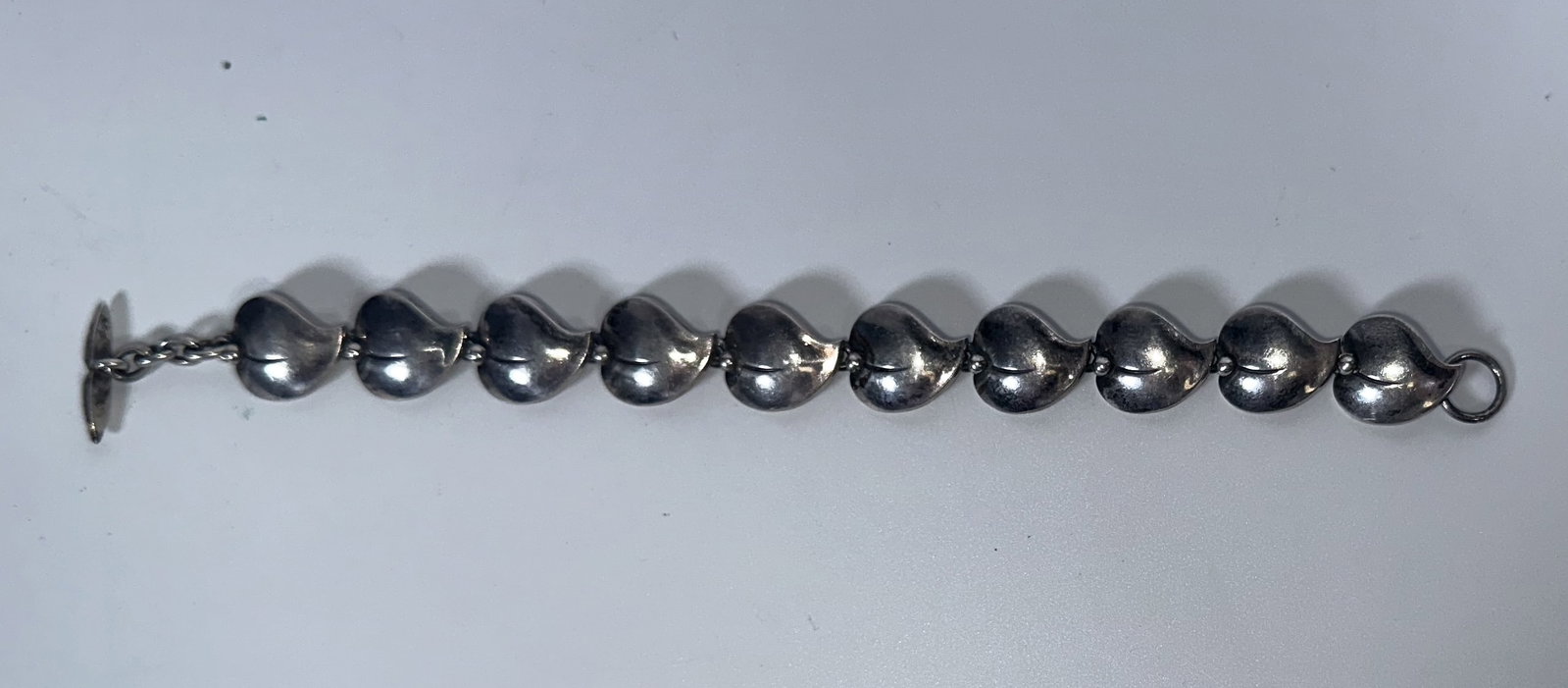 N. E. From Norway Silver Bracelet: N. E. From Norway Silver Bracelet Sterling silver bracelet by N. E. From of Norway. Nice mid century design on this 7 inch toggle bracelet. For this lot shipping can be done one of two ways: In-House 