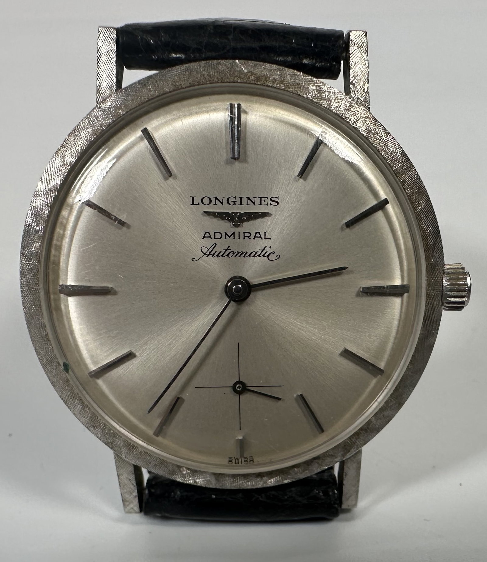 Vintage 14k White Gold Automatic Watch Longines Admiral: Vintage 14k White Gold Automatic Watch Longines Admiral This vintage Longines Admiral Automatic dress watch features a distinctive brushed silver sunburst dial and a unique textured bezel paired with 