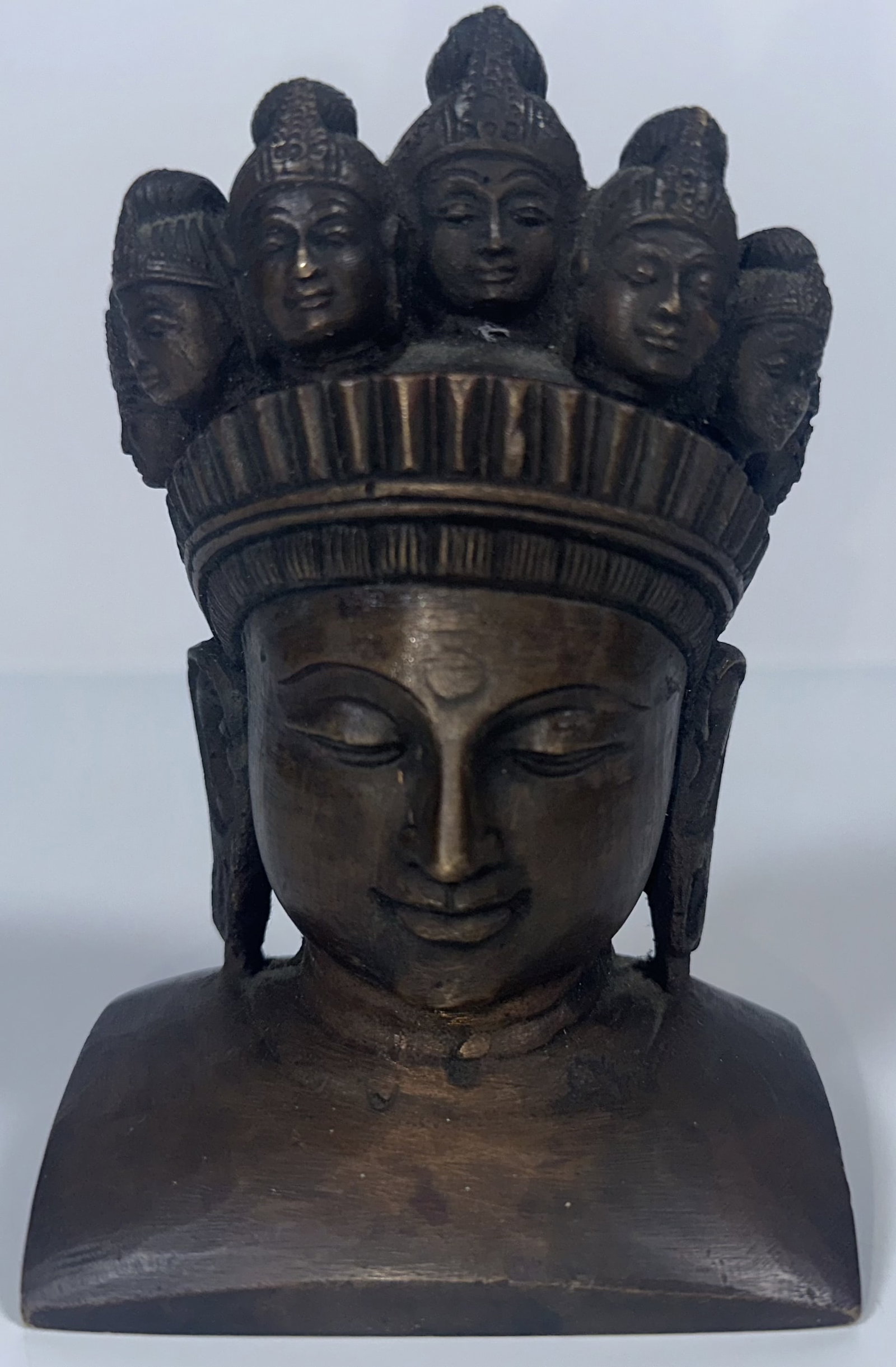 Antique Bronze 11 Face Buddha Bust: Antique Bronze 11 Face Buddha Bust This sculpture depicts Avalokiteshvara (also known as Ekadasamukha or the Eleven-Headed Bodhisattva of Compassion), rendered in a classic Southeast Asian or Himalaya