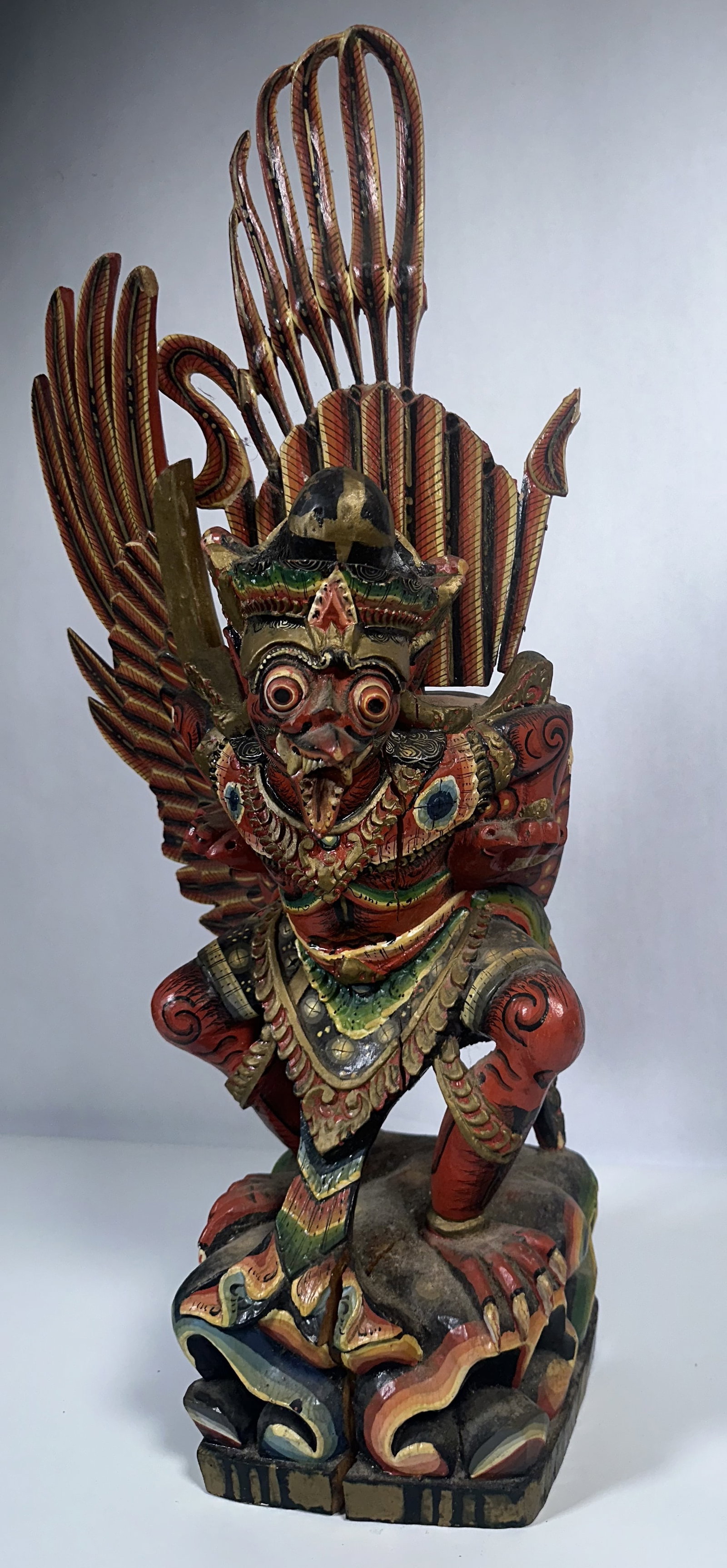 Wood Carved Bali Winged Goddess Garuda: Wood Carved Bali Winged Goddess Garuda This is a traditional hand-carved and polychrome-painted Balinese wooden sculpture depicting Garuda, the mythical bird-like divine mount from Hindu and Buddhist 