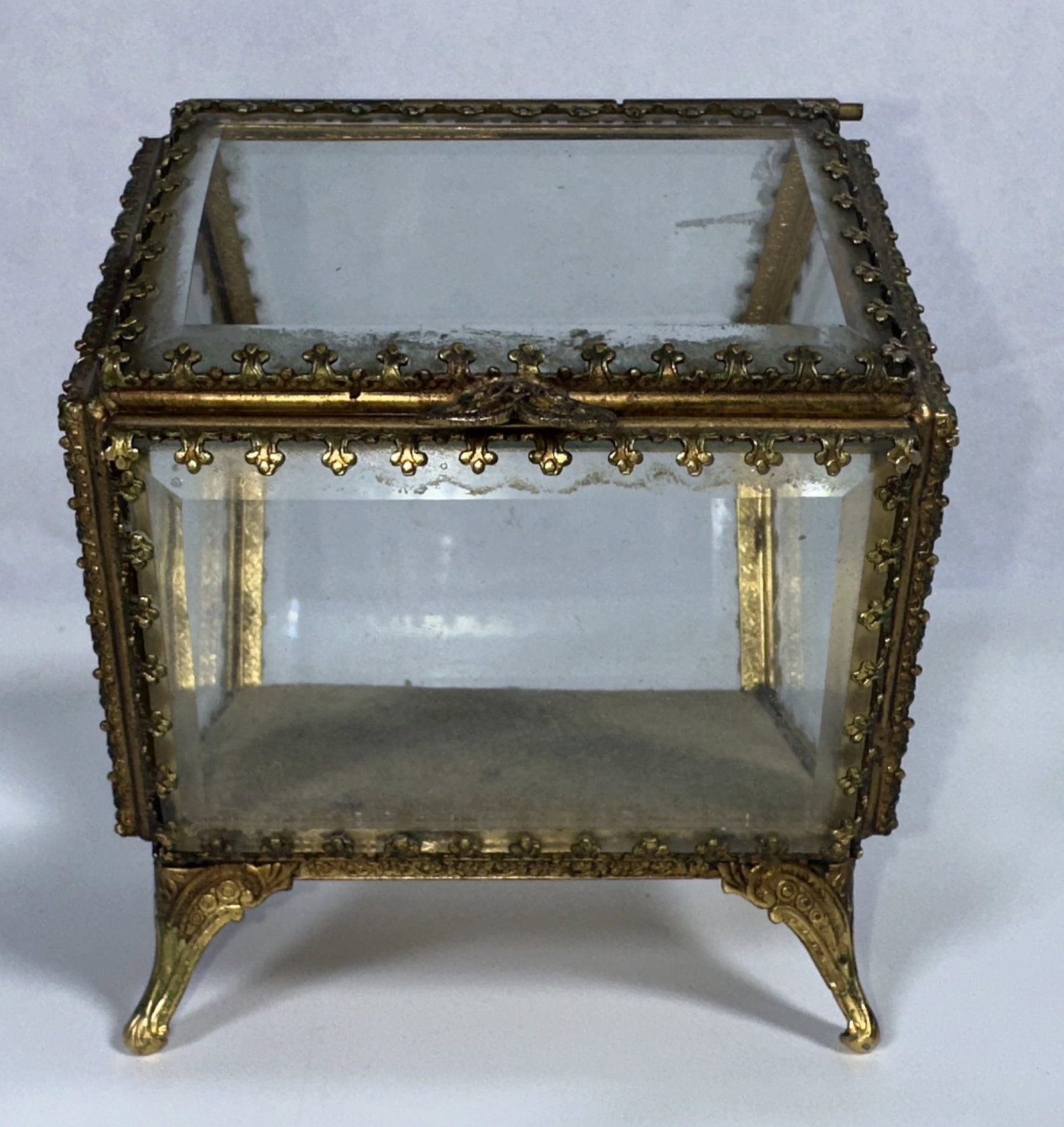 Antique Short Glass Jewelry Casket: Antique Short Glass Jewelry Casket An antique and interesting jewelry cabineet with a pentagon form. This piece is likely of French origin with beveled glass and gilt metal frame. One of the more inte