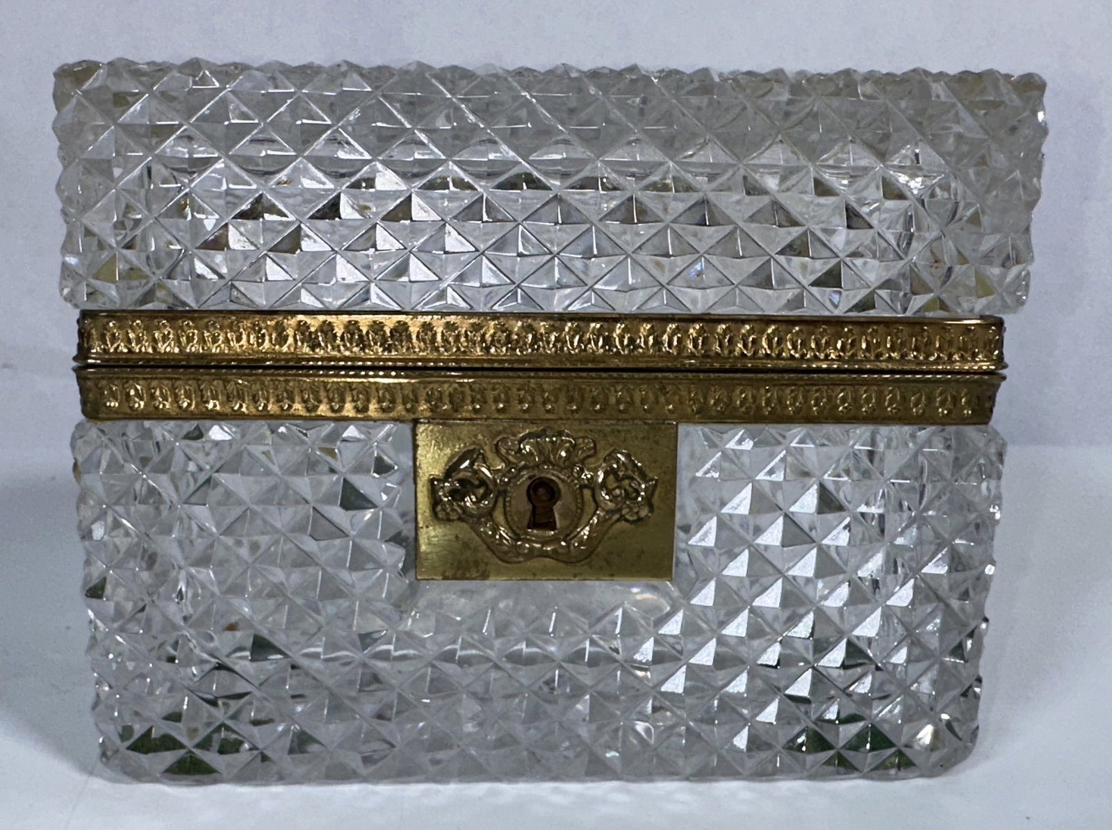 Large Cut Glass Rectangular Jewelry Casket: Large Cut Glass Rectangular Jewelry Casket This is a vintage French cut glass jewelry casket features a heavy diamond-faceted geometric pattern and a brass-trimmed hinged mount. Large for this type of