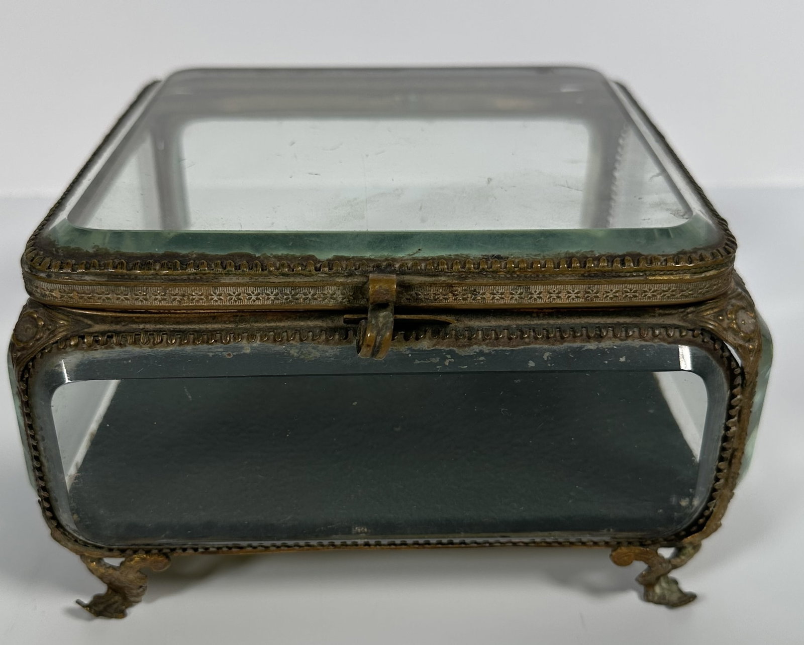 RR - Jewelry Casket - Gilt Repousse Frame Rounded Beveled Glass: Jewelry Casket - Gilt Repousse Frame Rounded Beveled Glass Classic French repousse gold tone frame jewelry casket with beveled glass panels with rounded corners. For this lot shipping can be done one 